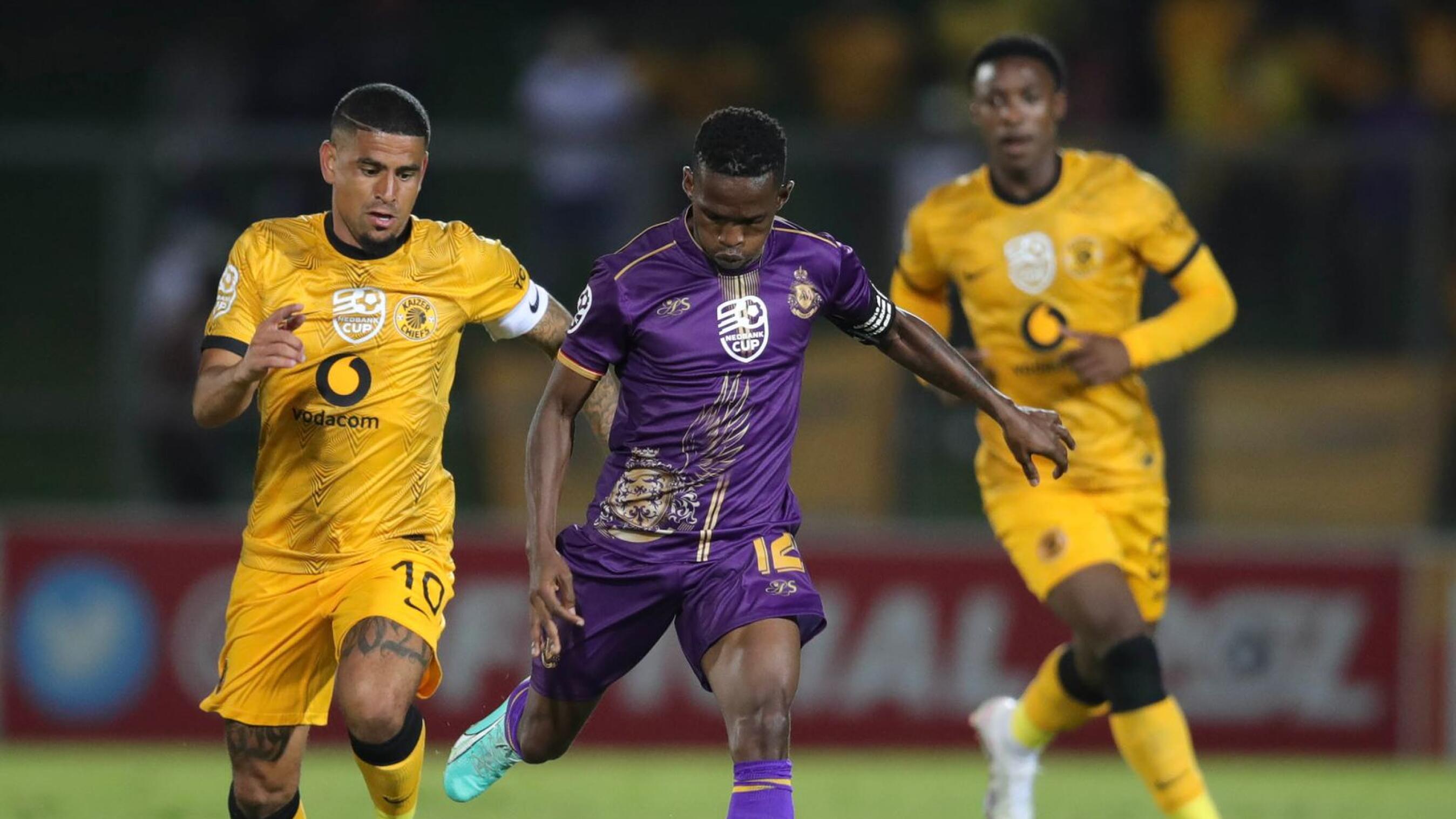 Kabelo Mahlasela of Royal AM is challenged by Keegan Dolly of Kaizer Chiefs during their Nedbank Cup match at Chatsworth Stadium in Durban on Sunday