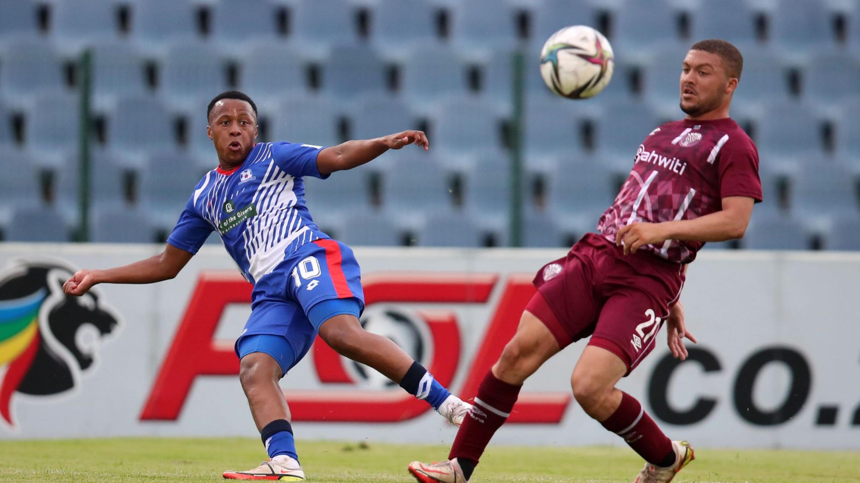 Rowan Human of Maritzburg United is challenged by Grant Margeman of Swallows FC during their DStv Premiership match at the Dobsonville Stadium in Soweto on Saturday