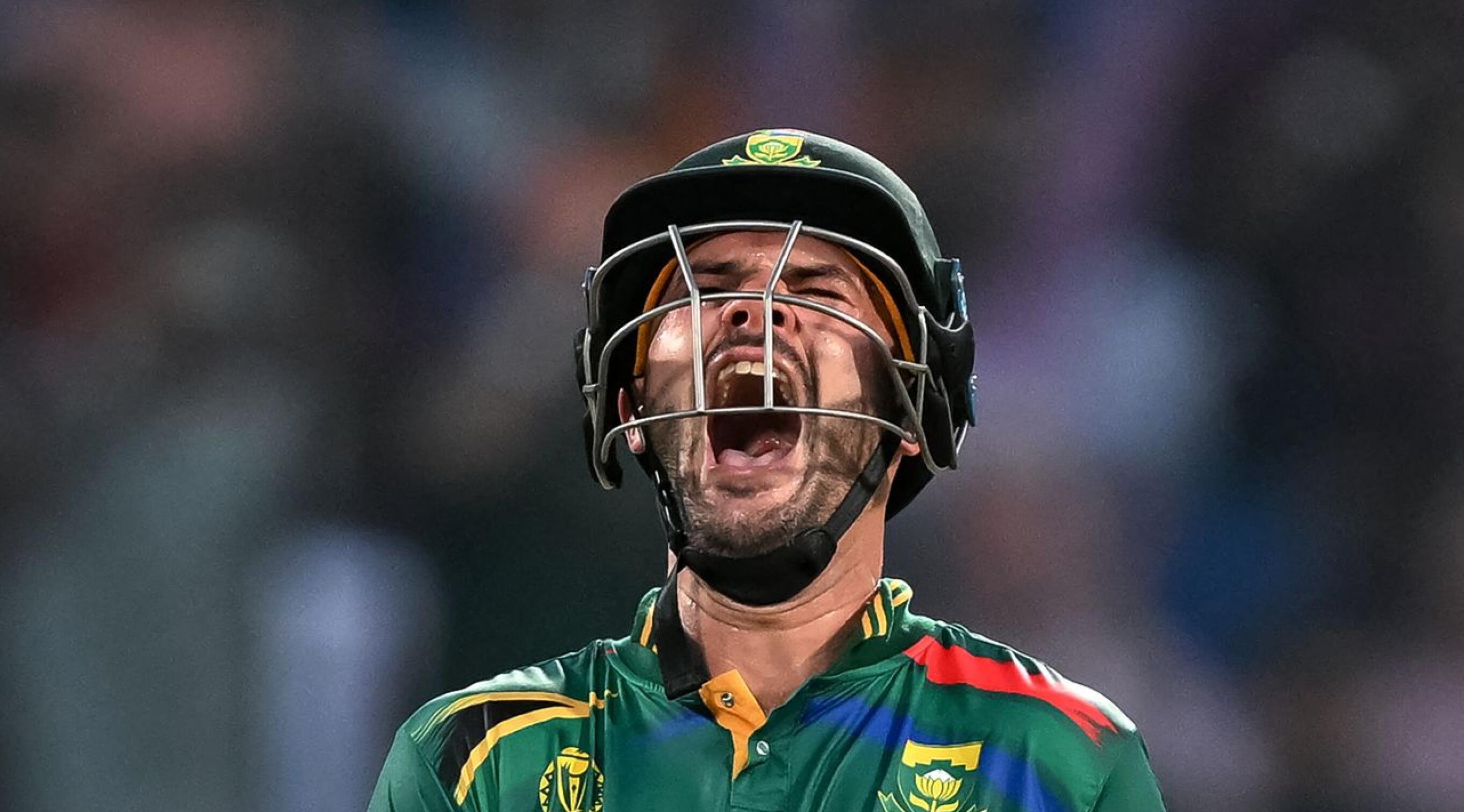 South Africa's Aiden Markram celebrates after scoring a century (100 runs) during the 2023 ICC Men's Cricket World Cup one-day international (ODI) match between South Africa and Sri Lanka at the Arun Jaitley Stadium in New Delhi