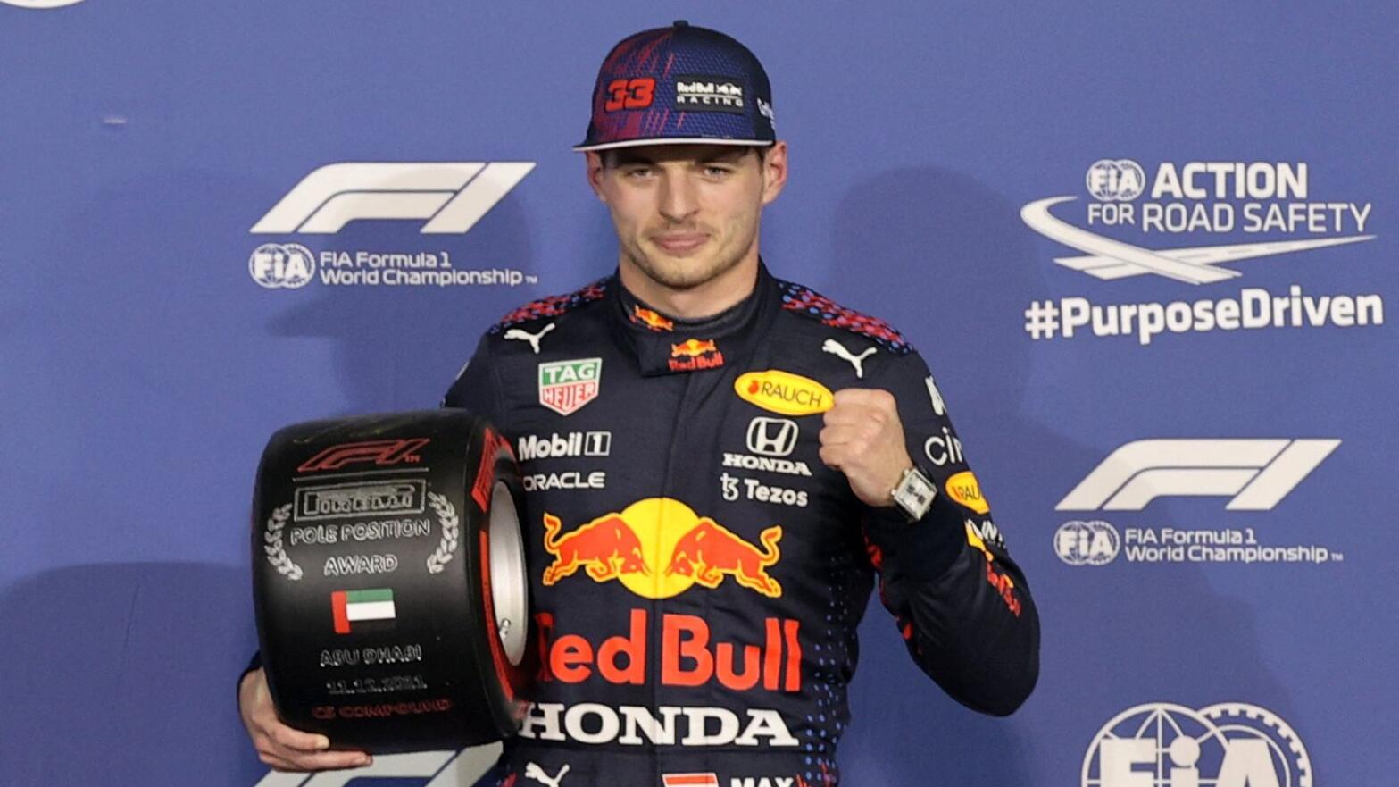 Red Bull's Max Verstappen poses with a tyre after qualifying in pole position for Sunday’s Abu Dhabi Grand Prix