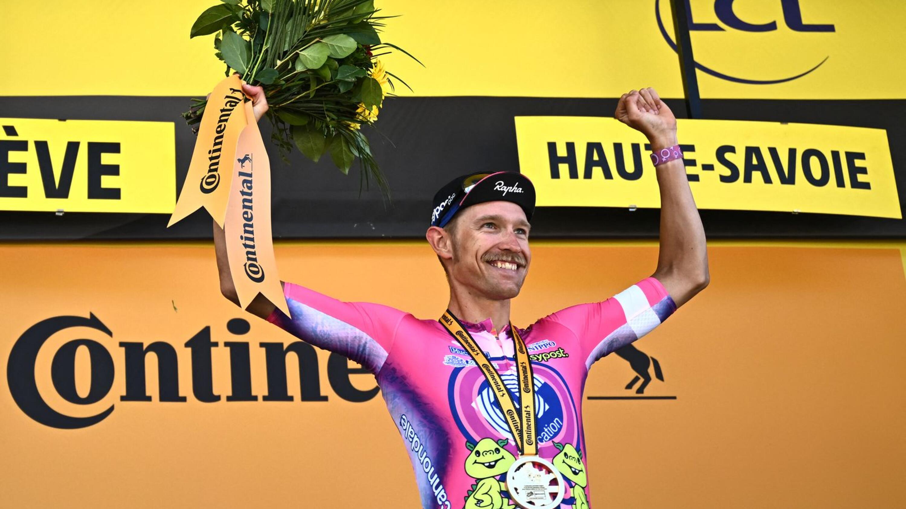 EF Education-Easypost team's Danish rider Magnus Cort Nielsen celebrates on the podium after winning the 10th stage of the 109th edition of the Tour de France cycling race, 148,1 km between Morzine and Megeve, in the French Alps, on Tuesday
