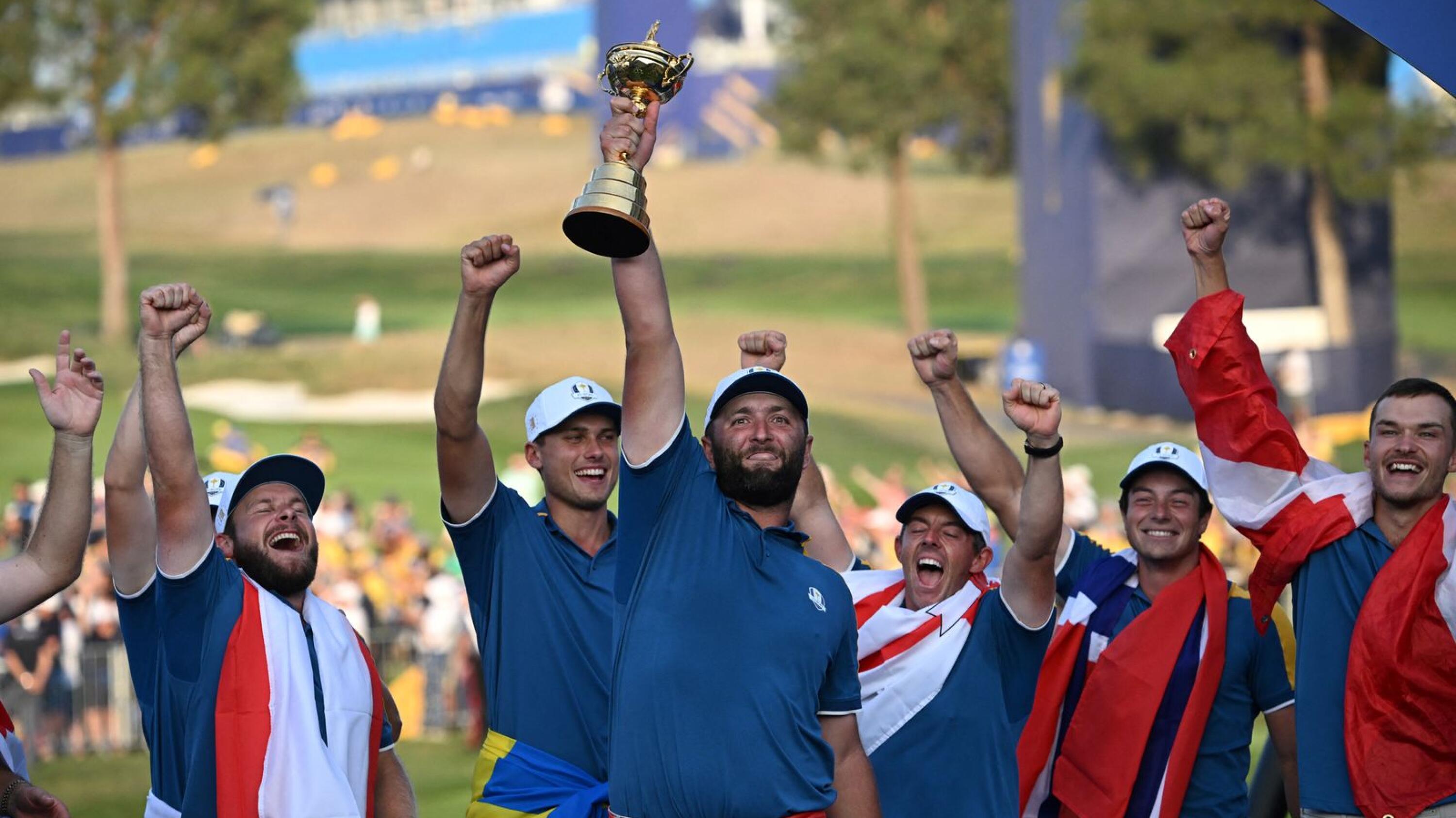 Europe's Spanish golfer Jon Rahm celebrates with The Ryder Cup