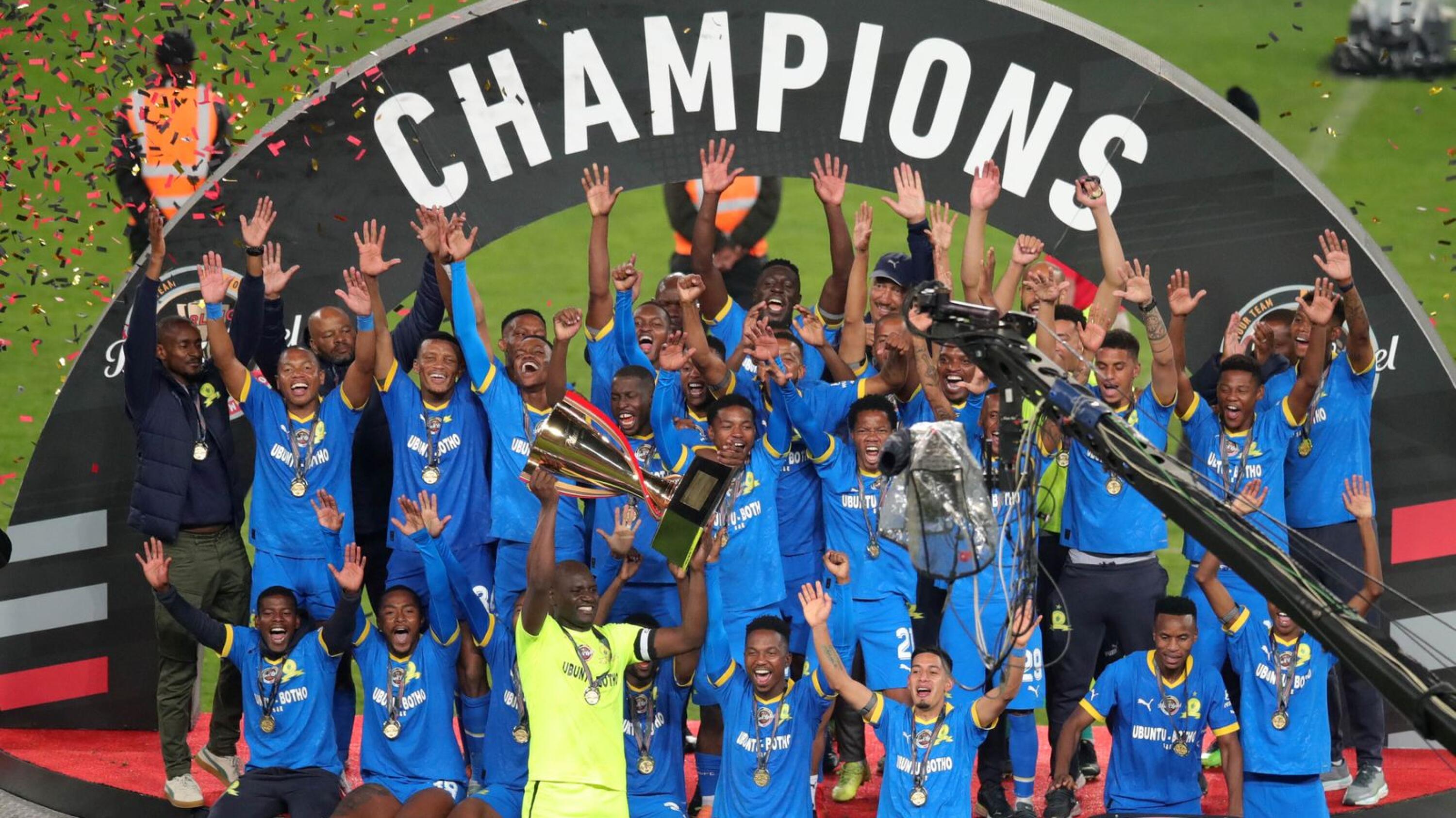 Mamelodi Sundowns celebrate with the trophy after beating Orlando Pirates in the final of the Carling Black Label Cup at FNB Stadium in Johannesburg on Saturday