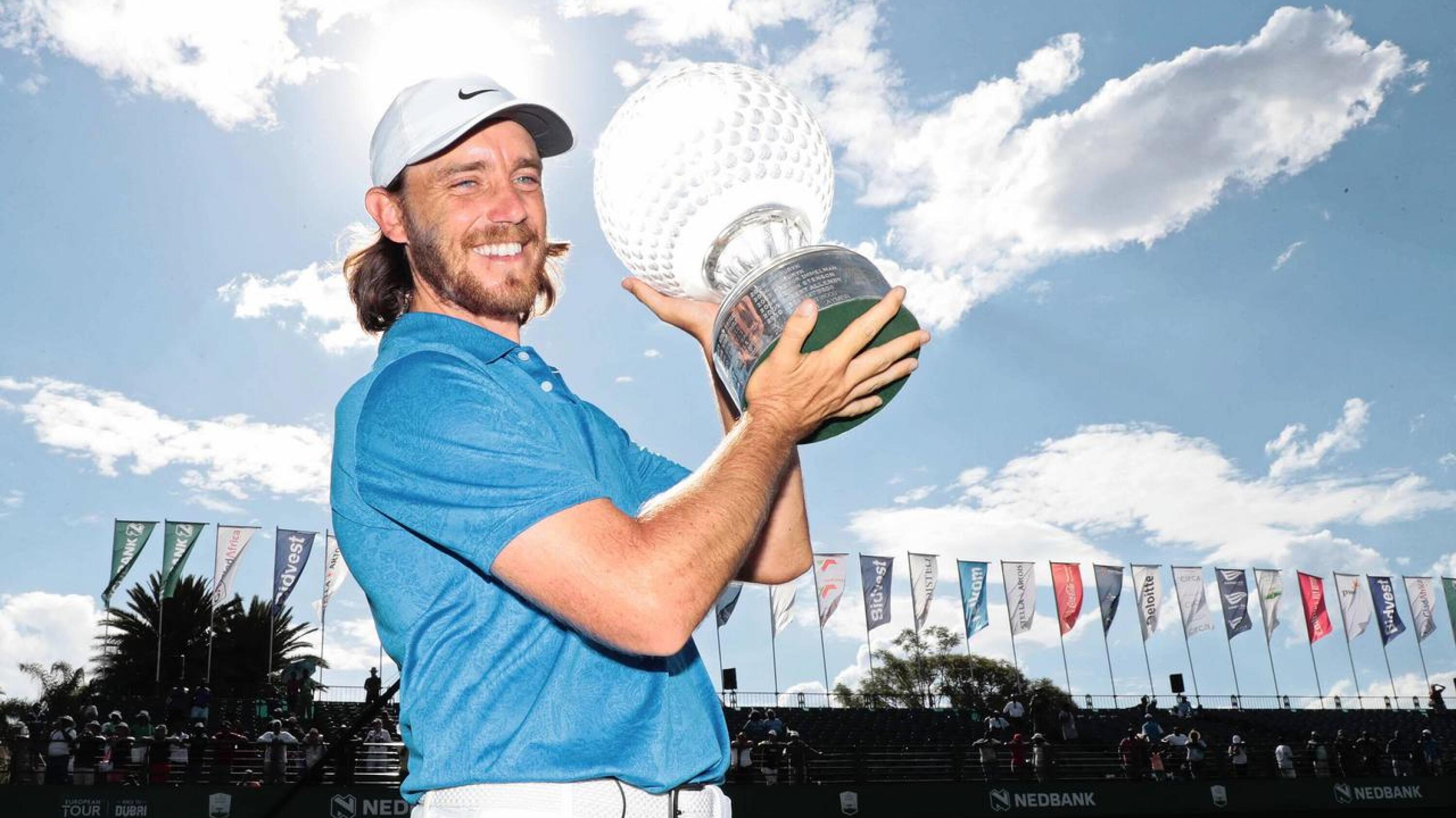 England’s Tommy Fleetwood holds up the Nedbank Golf Challenge trophy