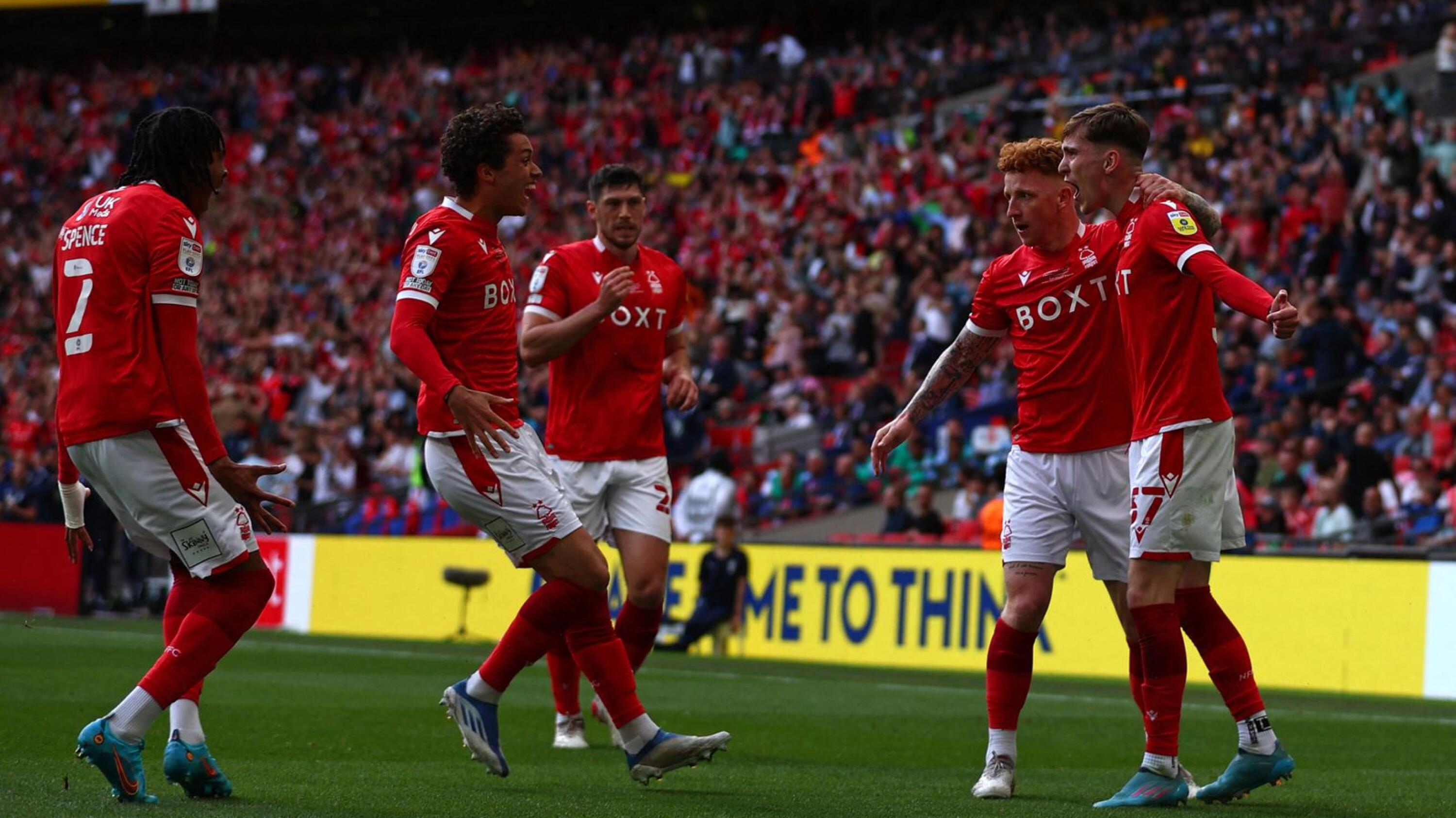 Nottingham Forest's team-players celebrates after Huddersfield Town's English defender Levi Colwill (unseen) scored an own goal during their English Championship play-off final at Wembley Stadium in London, on Sunday