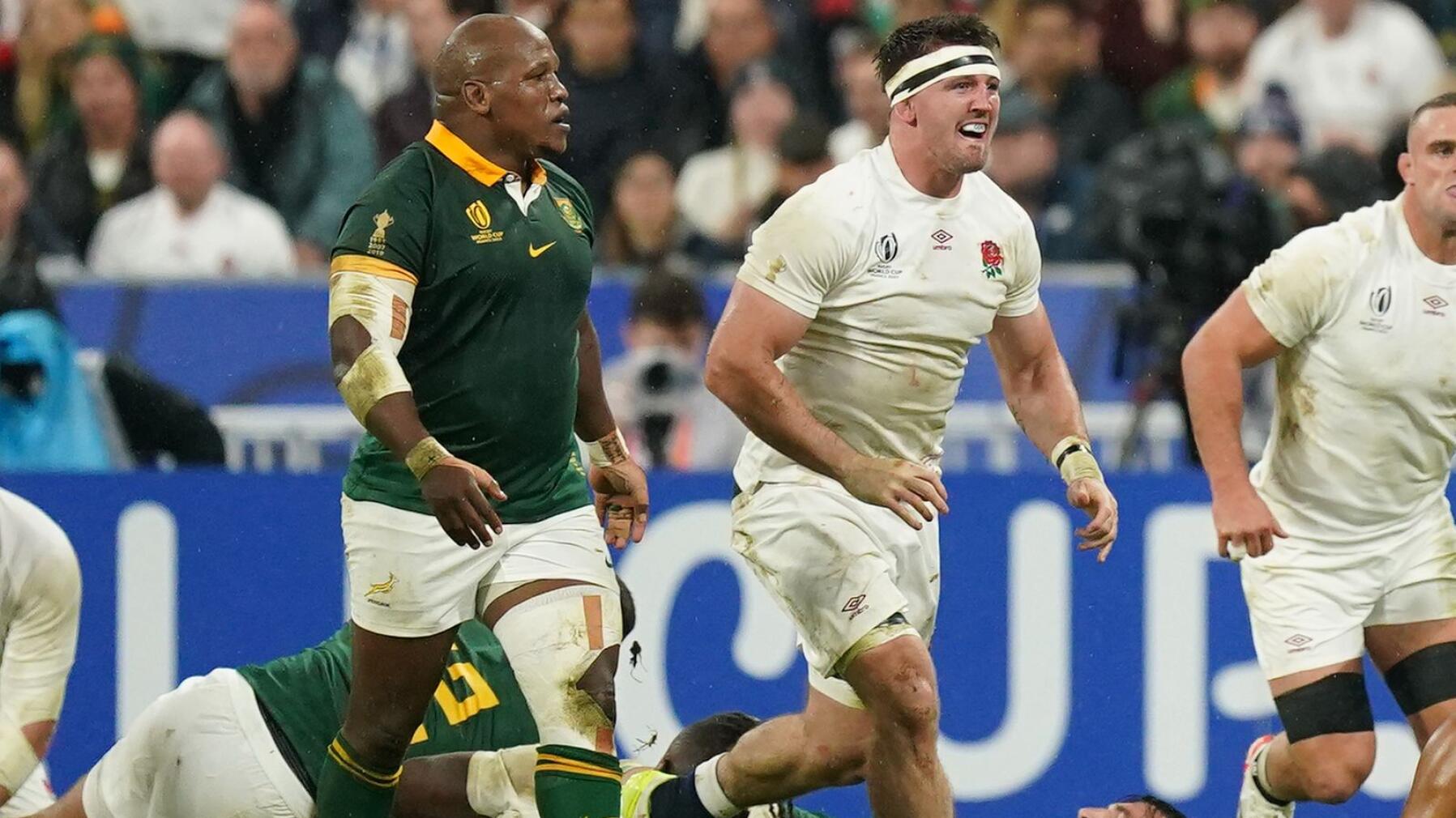 The Springboks' Bongi Mbonambi and England's Tom Curry during the Rugby World Cup semi final.