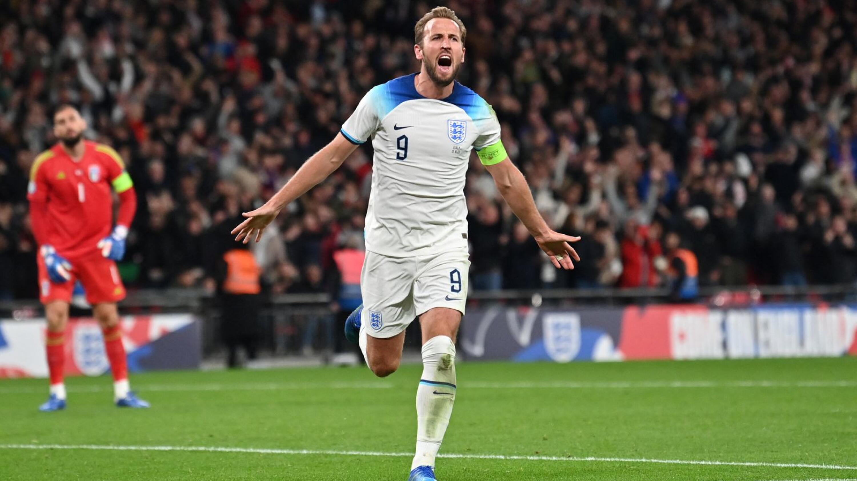 England's striker #09 Harry Kane celebrates after scoring his team third goal during the Euro 2024 qualifying match against Italy