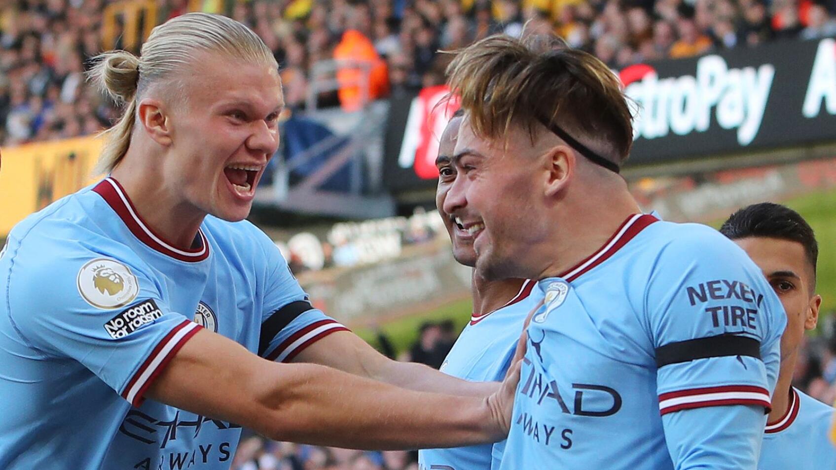 Manchester City's Jack Grealish celebrates with teammates after scoring the opening goal during their Premier League game against Wolverhampton Wanderers at Molineux Stadium in Wolverhampton on Saturday
