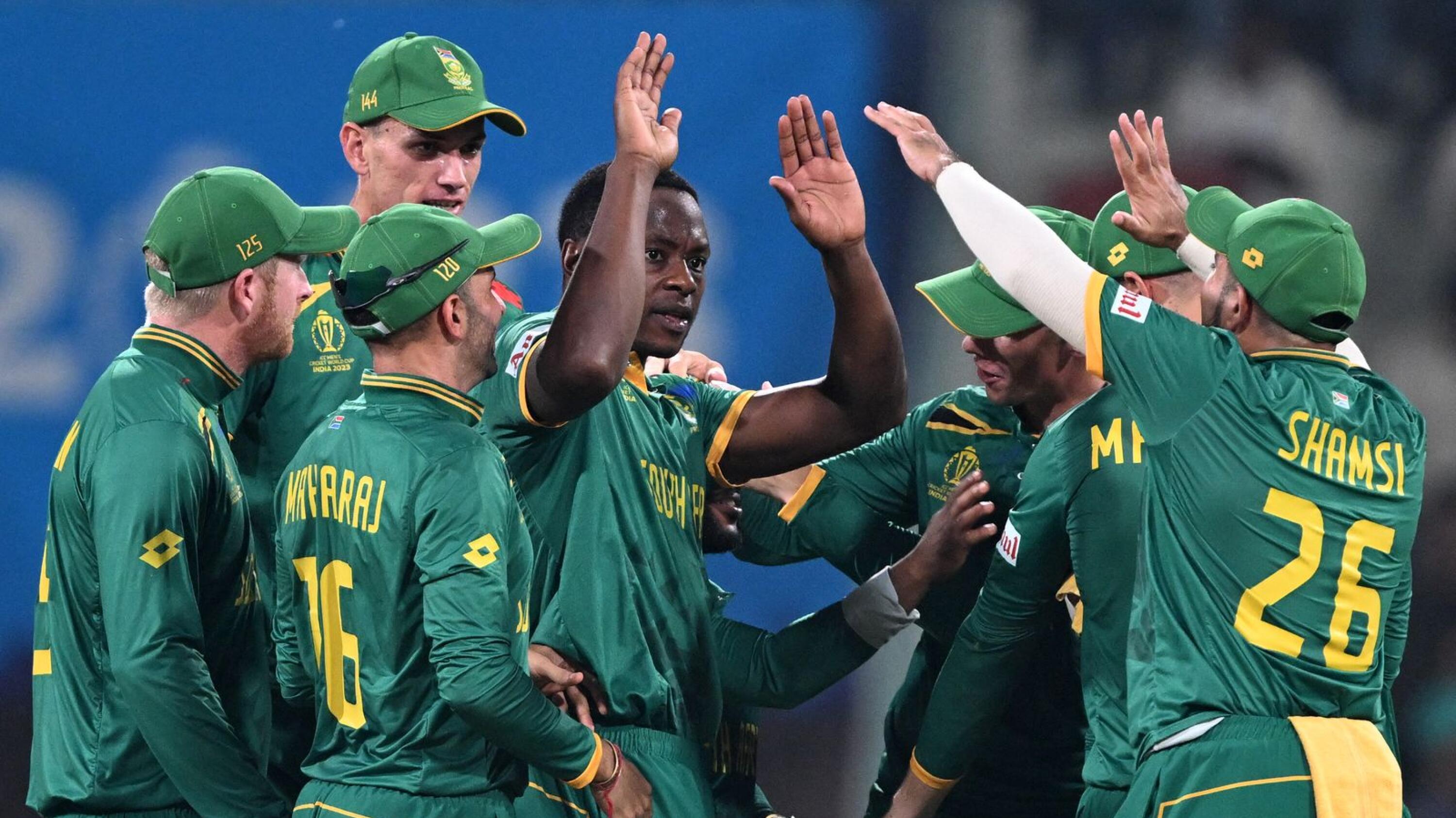 South Africa's Kagiso Rabada celebrates with teammates after taking the wicket of Australia's Steve Smith