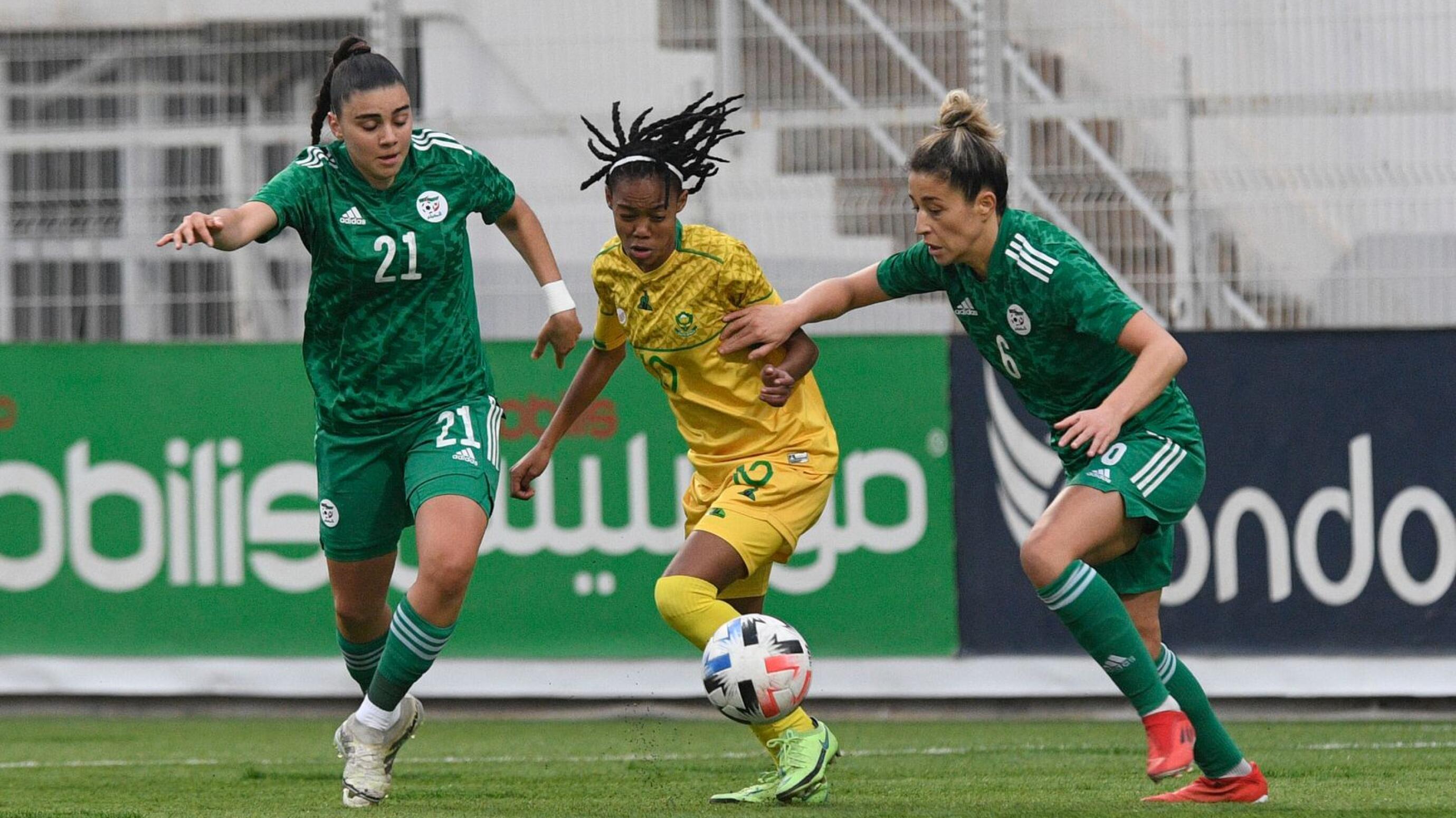 Linda Mothlalo of South Africa challenges Lydia Belkacemi of Algeria during their Africa Women Cup of Nations qualifier at Omar Hamadi Stadium in Algeria on Wednesday