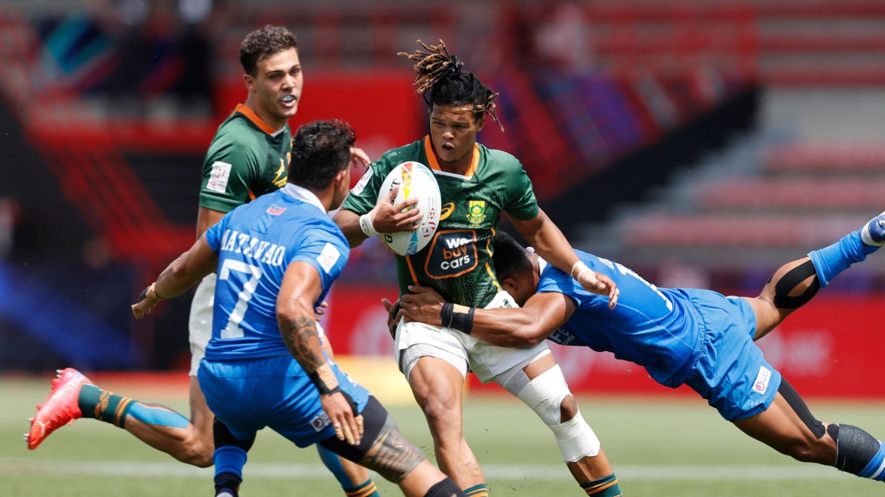 South Africa's Dewald Human charges through the Samoa defense on day two of the HSBC France Sevens men's competition at Stade Toulousain in Toulouse, France on Saturday