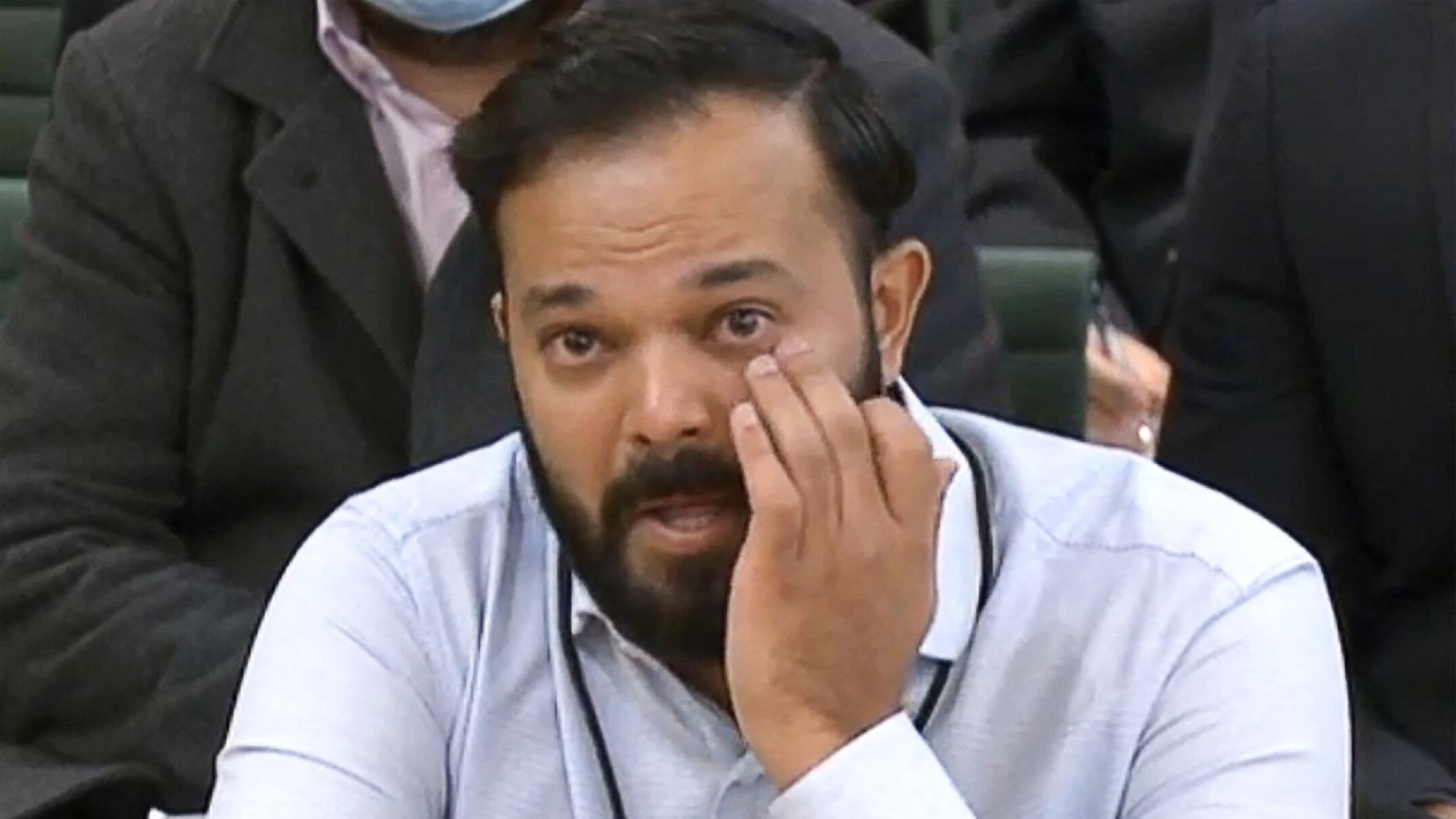 A video grab from footage broadcast by the UK Parliament's Parliamentary Recording Unit (PRU) shows former Yorkshire cricketer Azeem Rafiq fighting back tears while testifying in front of a Digital, Culture, Media and Sport (DCMS) Committee in London on November 16, 2021 as MPs probe racial harassment at the club