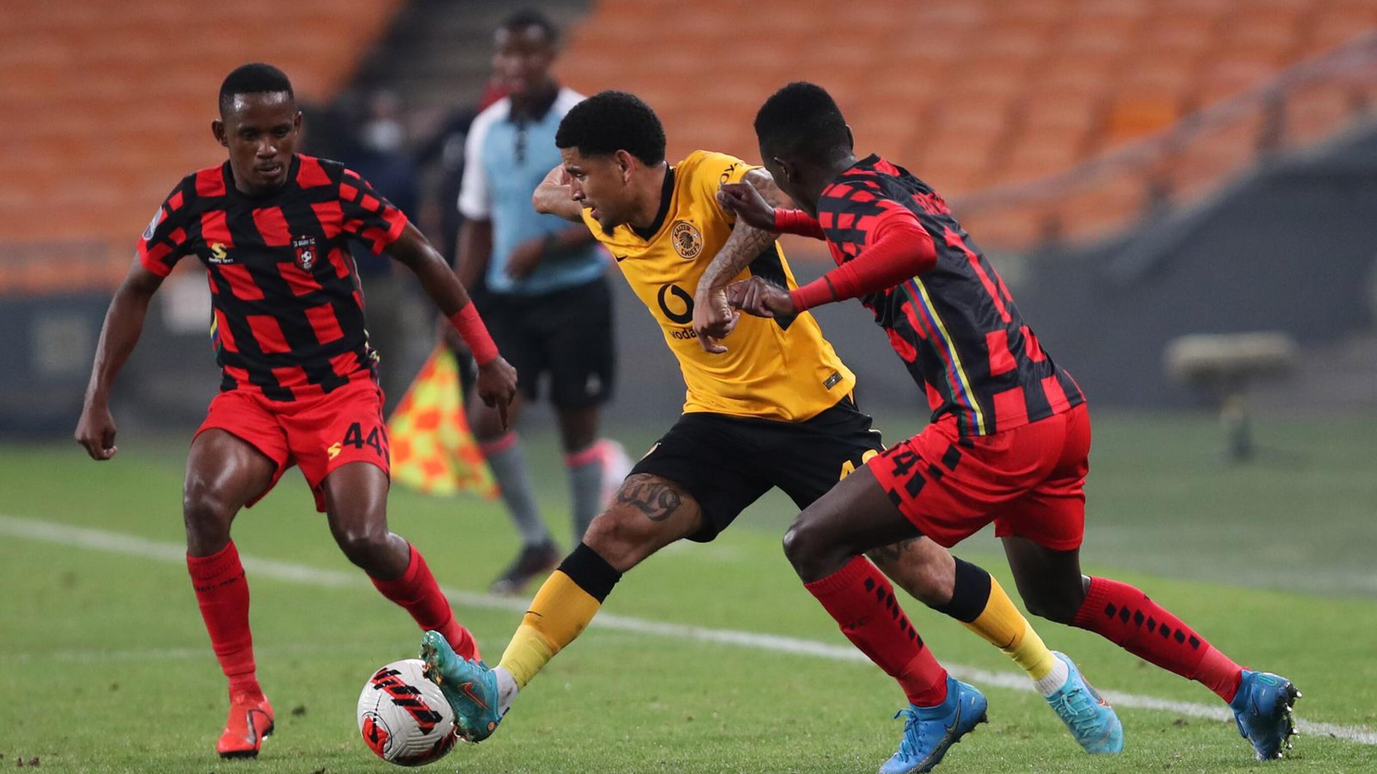 Keagan Dolly of Kaizer Chiefs is challenged by Orebotse Mongae of TS Galaxy during their DStv Premiership match at FNB Stadium in Johannesburg on Tuesday