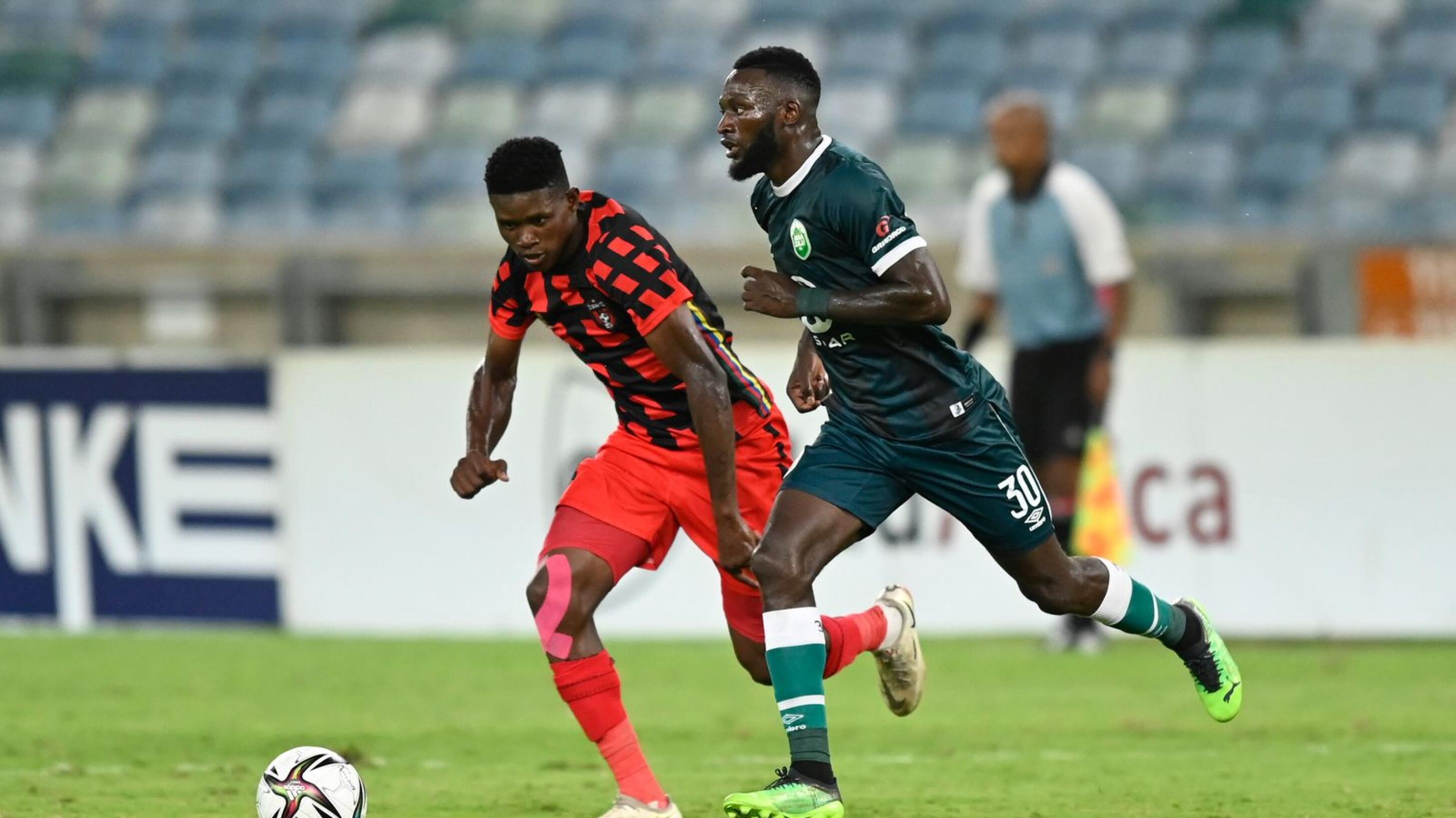 Bathusi Aubaas of TS Galaxy competes with Augustine Mulenga of AmaZulu FC during their DStv Premiership match at Moses Mabhida Stadium in Durban on Tuesday