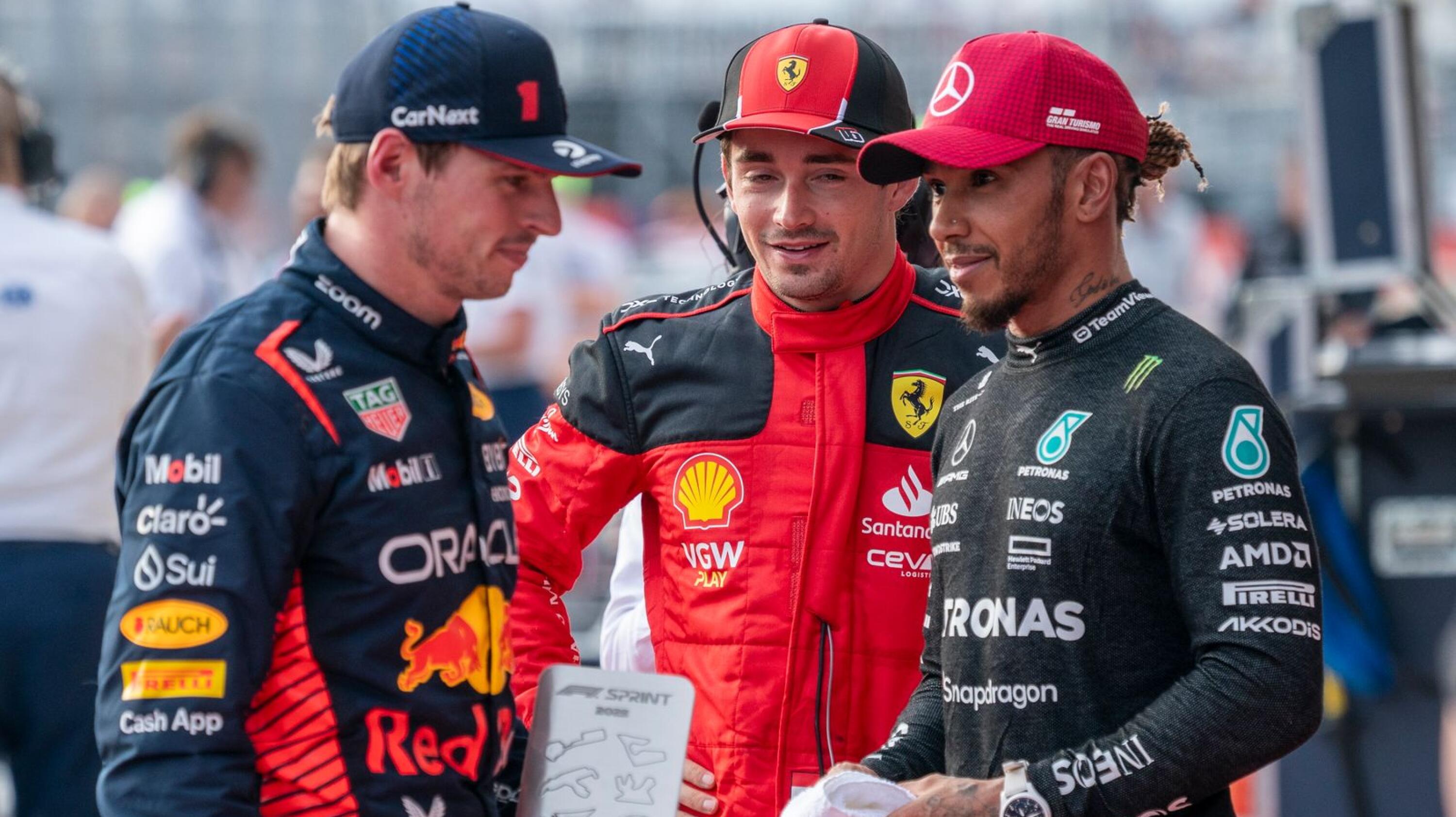 Red Bull’s Max Verstappen, Ferrari’s driver Charles Leclerc, and Mercedes’ Lewis Hamilton have a chat following the sprint race ahead of the United States Grand Prix.