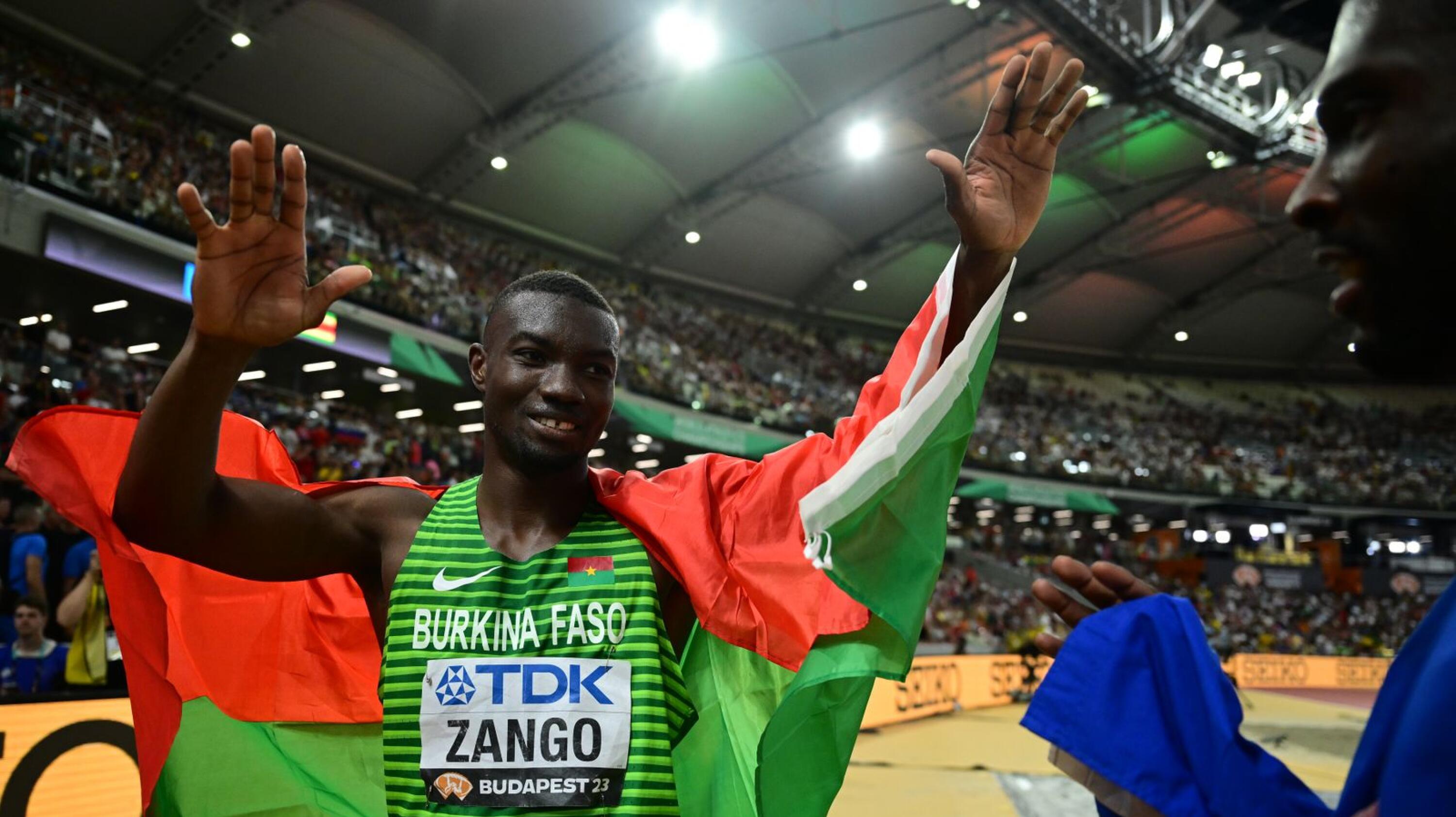 Hugues Fabrice Zango celebrates with the Burkina Faso flag 