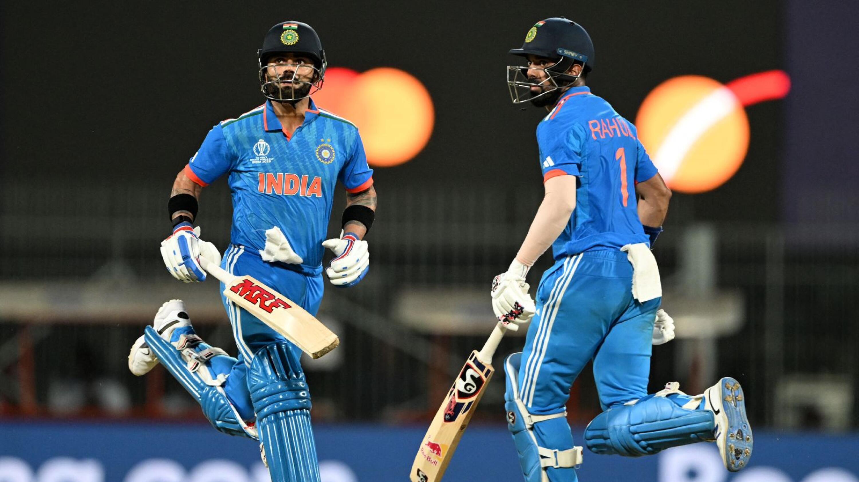 India's Virat Kohli and KL Rahul run between the wickets during their Cricket World Cup match against Australia
