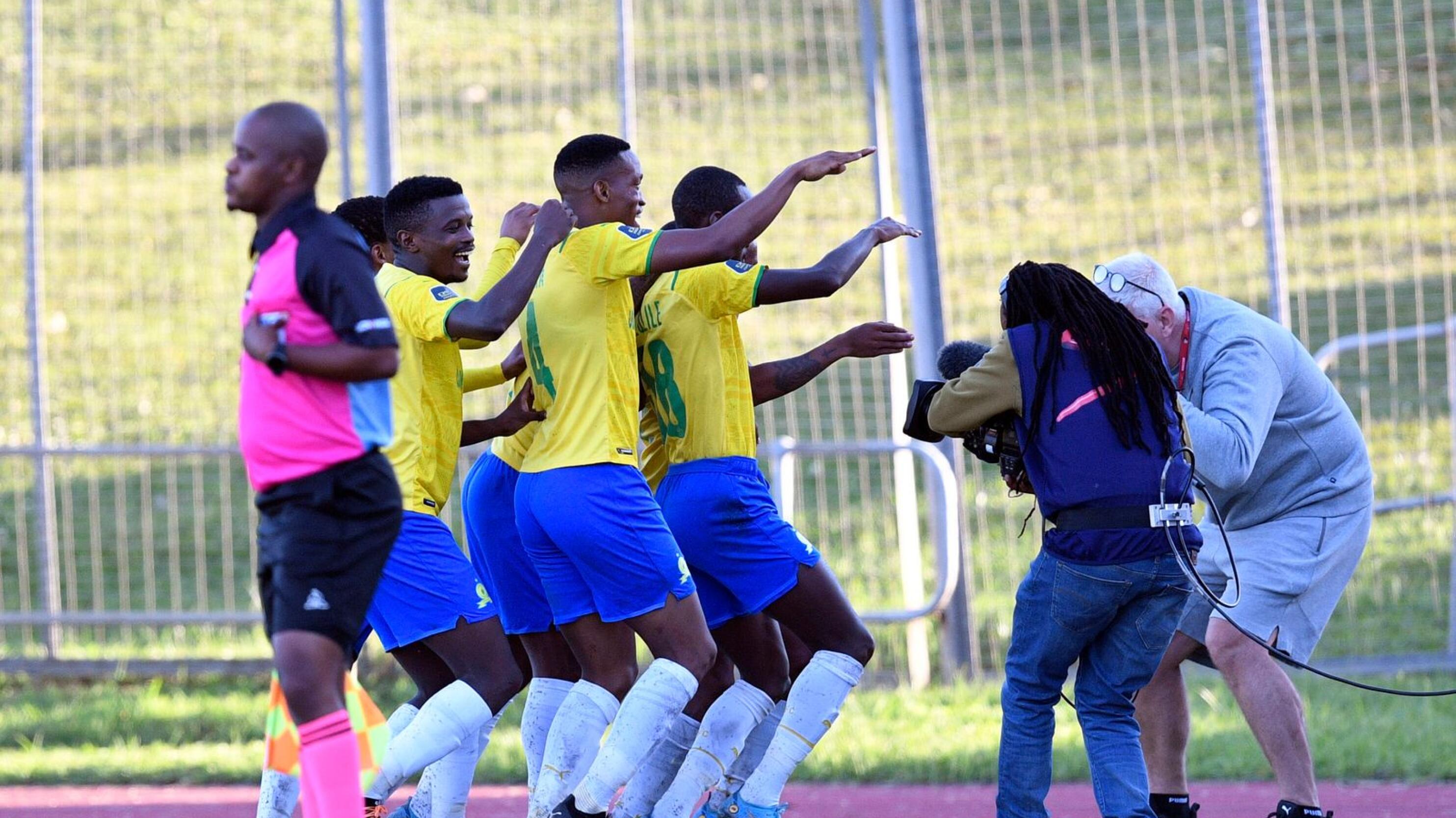 Thabiso Kutumela of Mamelodi Sundowns celebrates with teammates after scoring their second goal during their DStv Premiership game against Royal AM at Chatsworth Stadium on Monday