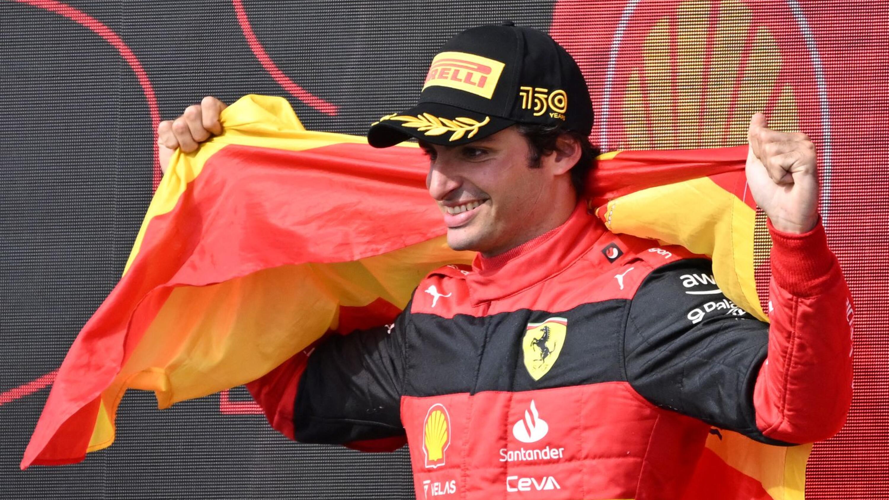 Ferrari's Spanish driver Carlos Sainz Jr celebrates after winning the Formula One British Grand Prix at the Silverstone motor racing circuit in Silverstone, central England on Saturday