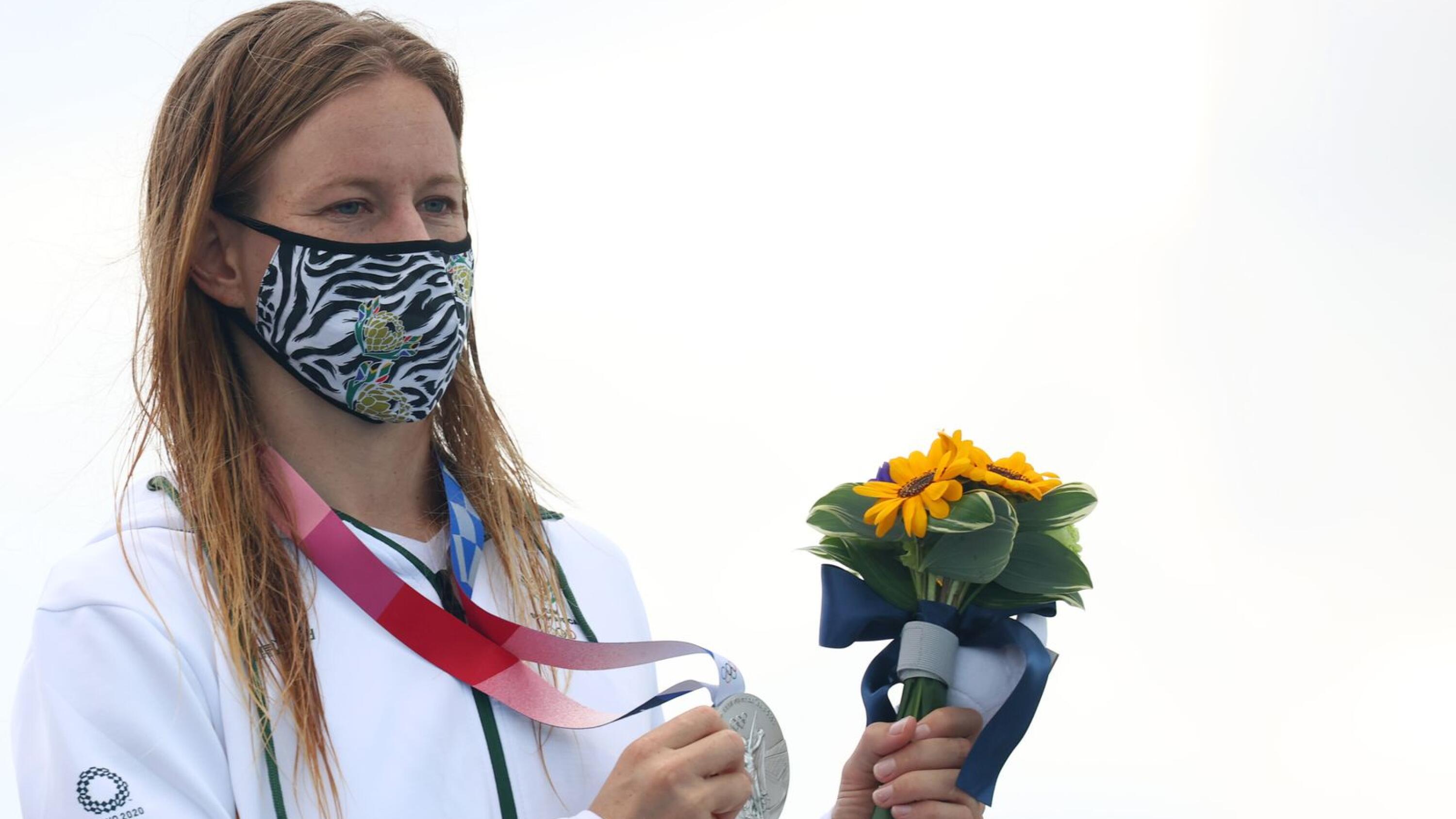 Silver medallist, Bianca Buitendag of South Africa wearing a protective face mask poses on the podium