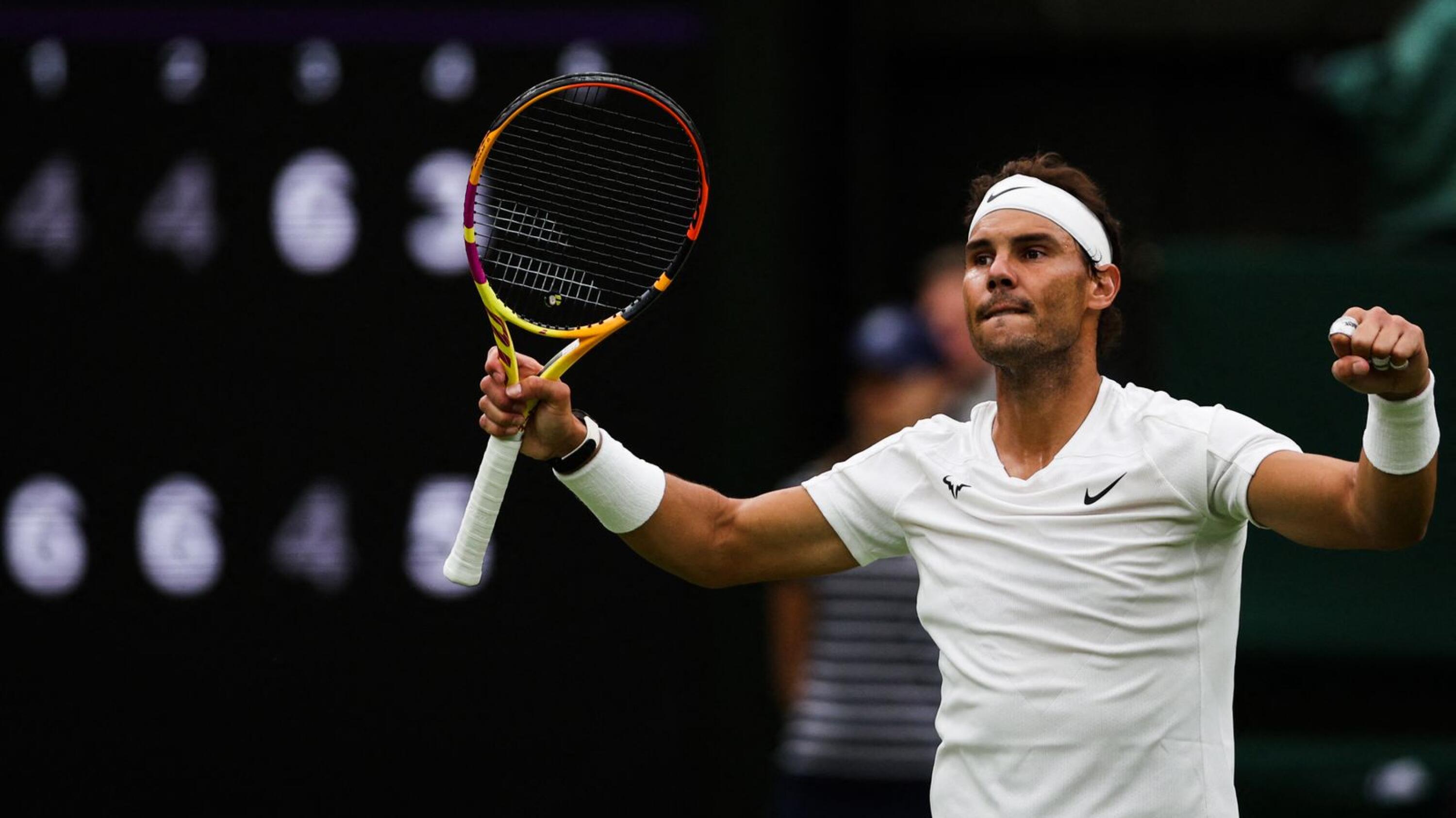 Spain's Rafael Nadal celebrates winning against Lithuania's Ricardas Berankis at the end of their men's singles tennis match on the fourth day of the 2022 Wimbledon Championships at The All England Tennis Club in Wimbledon, southwest London on Thursday