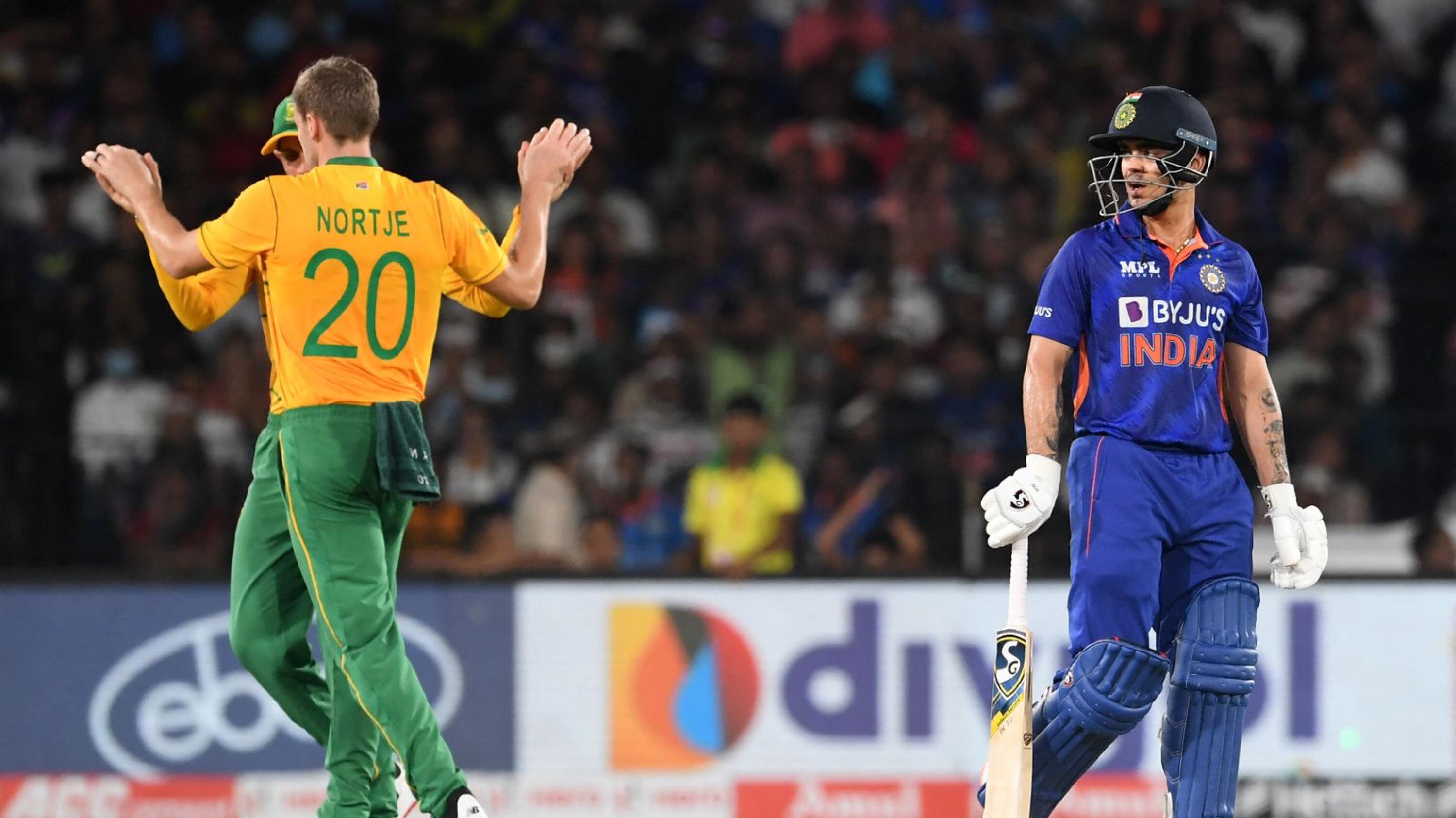 South Africa's Anrich Nortje celebrates after taking the wicket of India's Ishan Kishan (R) during the second Twenty20 international cricket match at the Barabati Stadium in Cuttack on Sunday