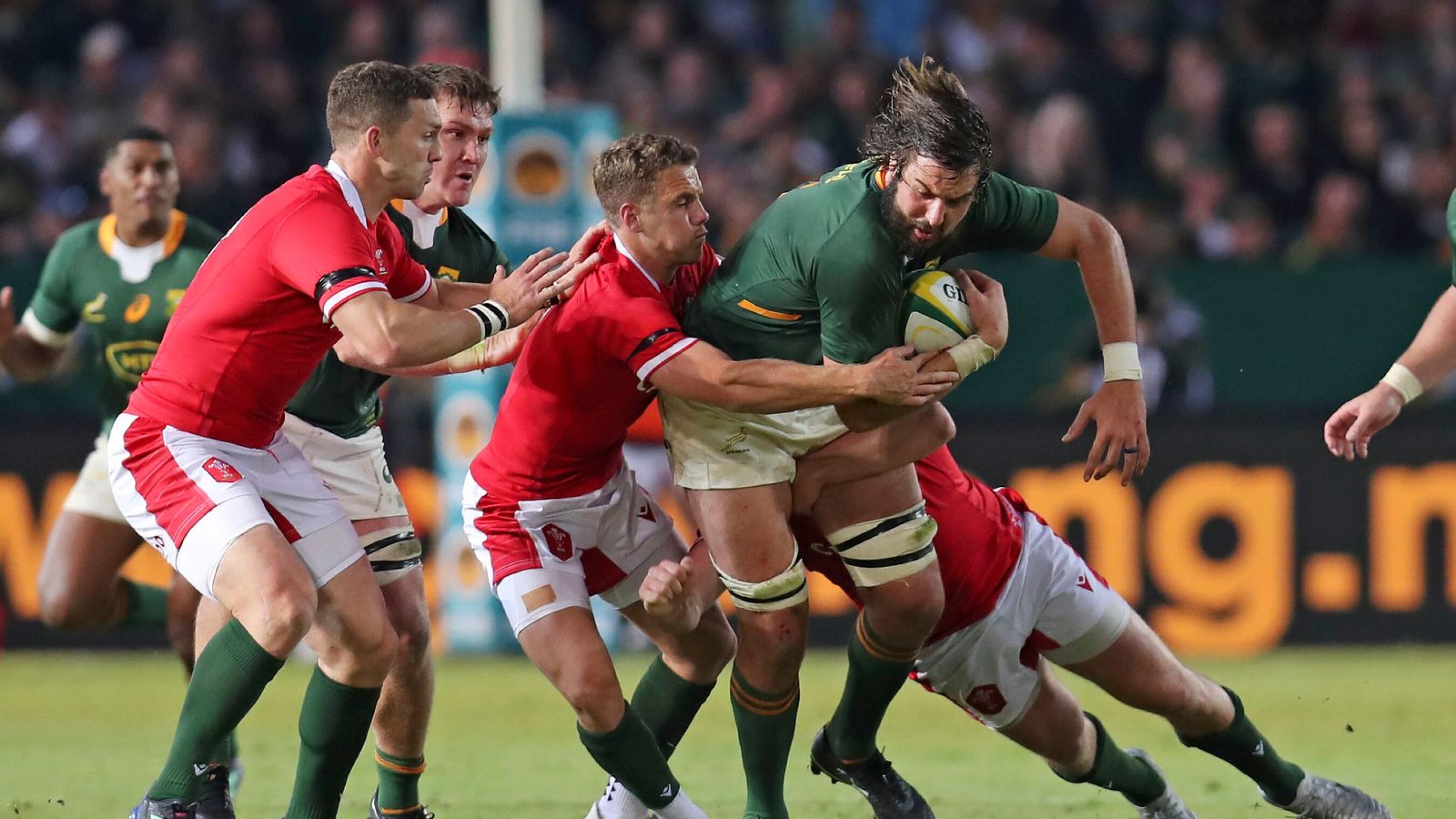 Lood de Jager of South Africa is tackled by Kieran Hardy (l) and Ryan Elias of Wales during their Incoming Series Test match at Loftus Stadium in Tshwane on Saturday