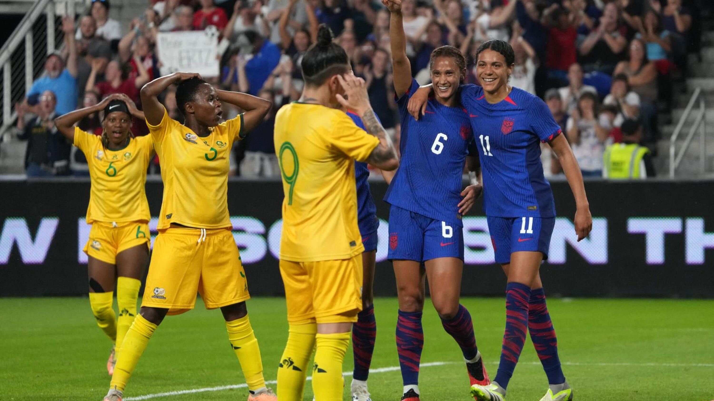 Lynn Williams #6 and Alana Cook #11 of the United States celebrate a goal during a international friendly match against Banyana Banyana 