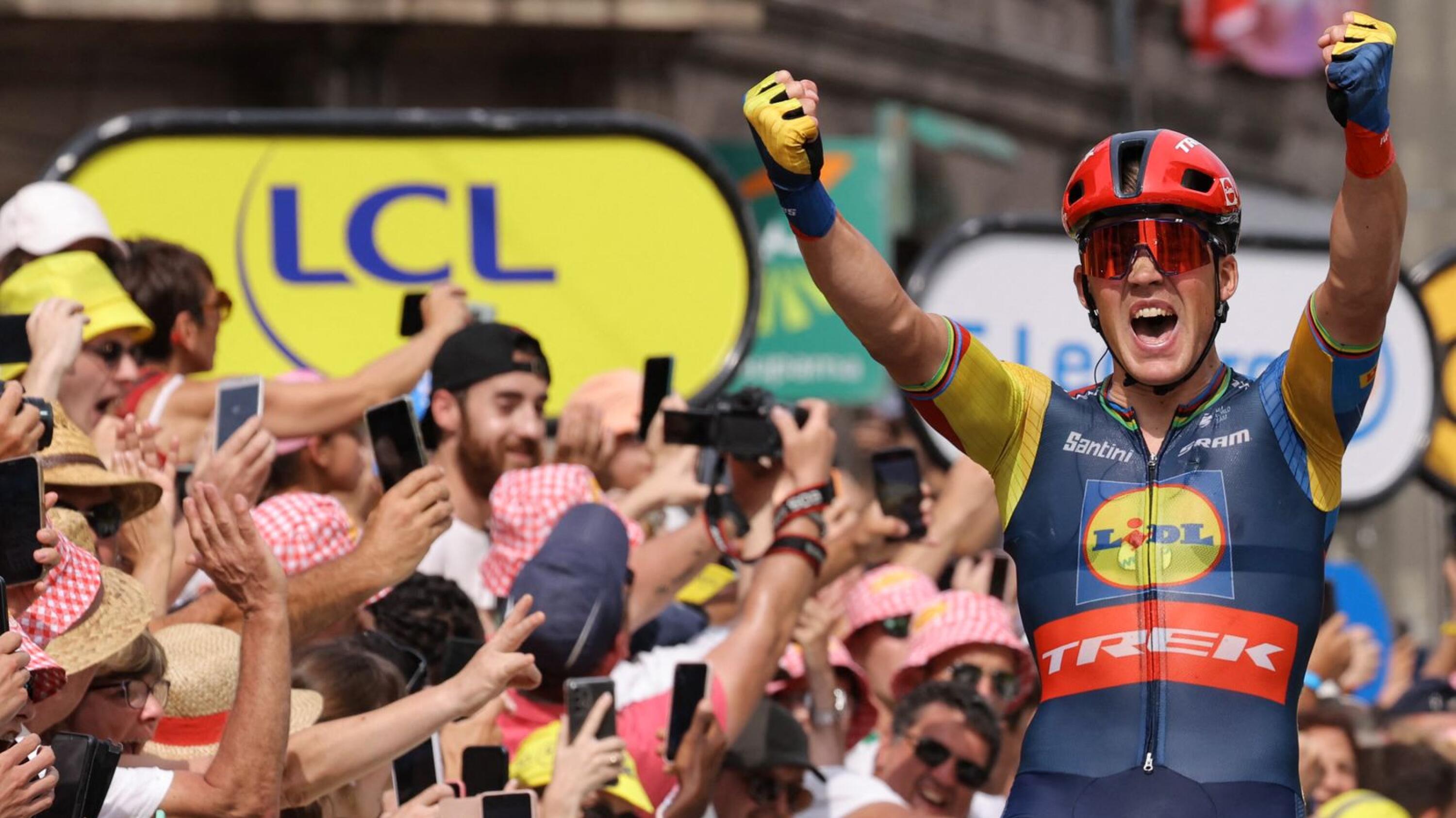 Lidl - Trek's Danish rider Mads Pedersen celebrates as he cycles to the finish line to win the 8th stage of the 110th edition of the Tour de France cycling race on Saturday
