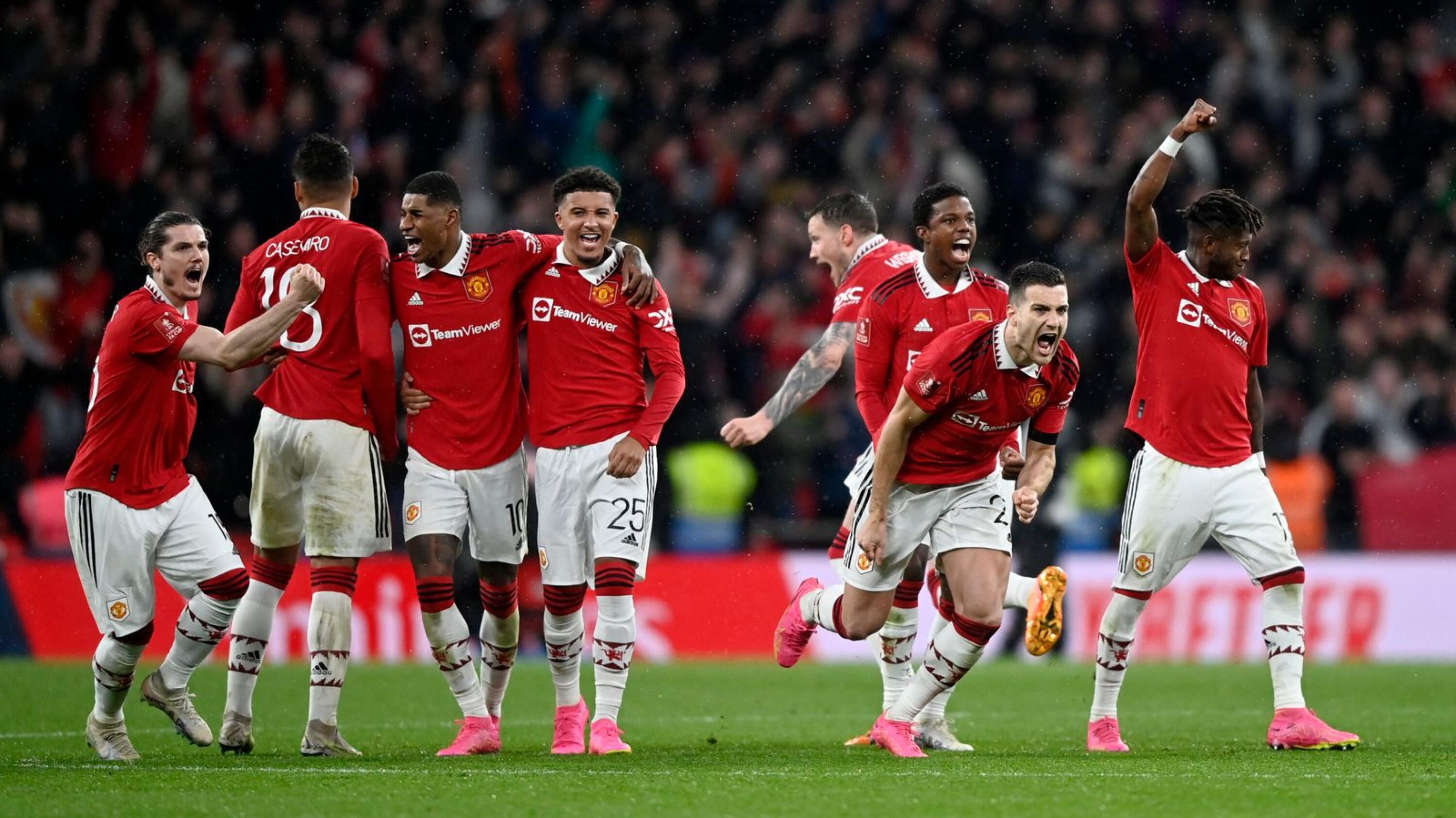 United players celebrate after winning a penalty shootout against Brighton on Sunday.