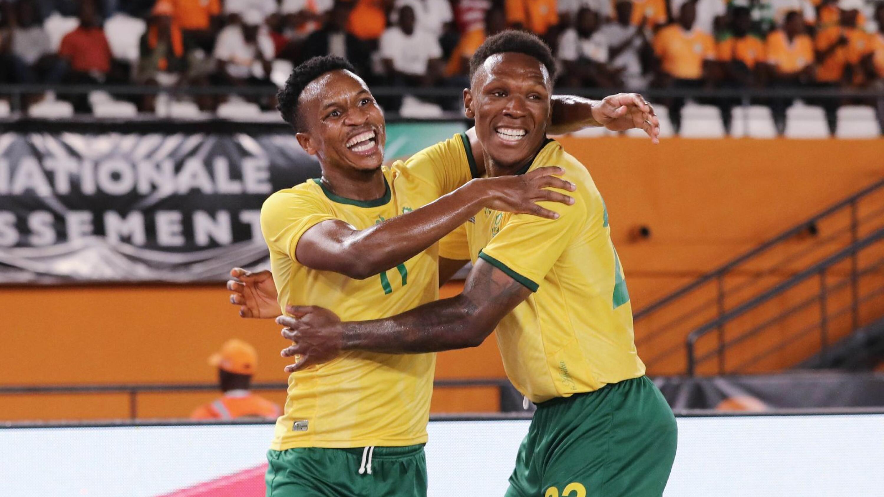 Themba Zwane of South Africa (l) celebrates goal with Lebo Mothiba