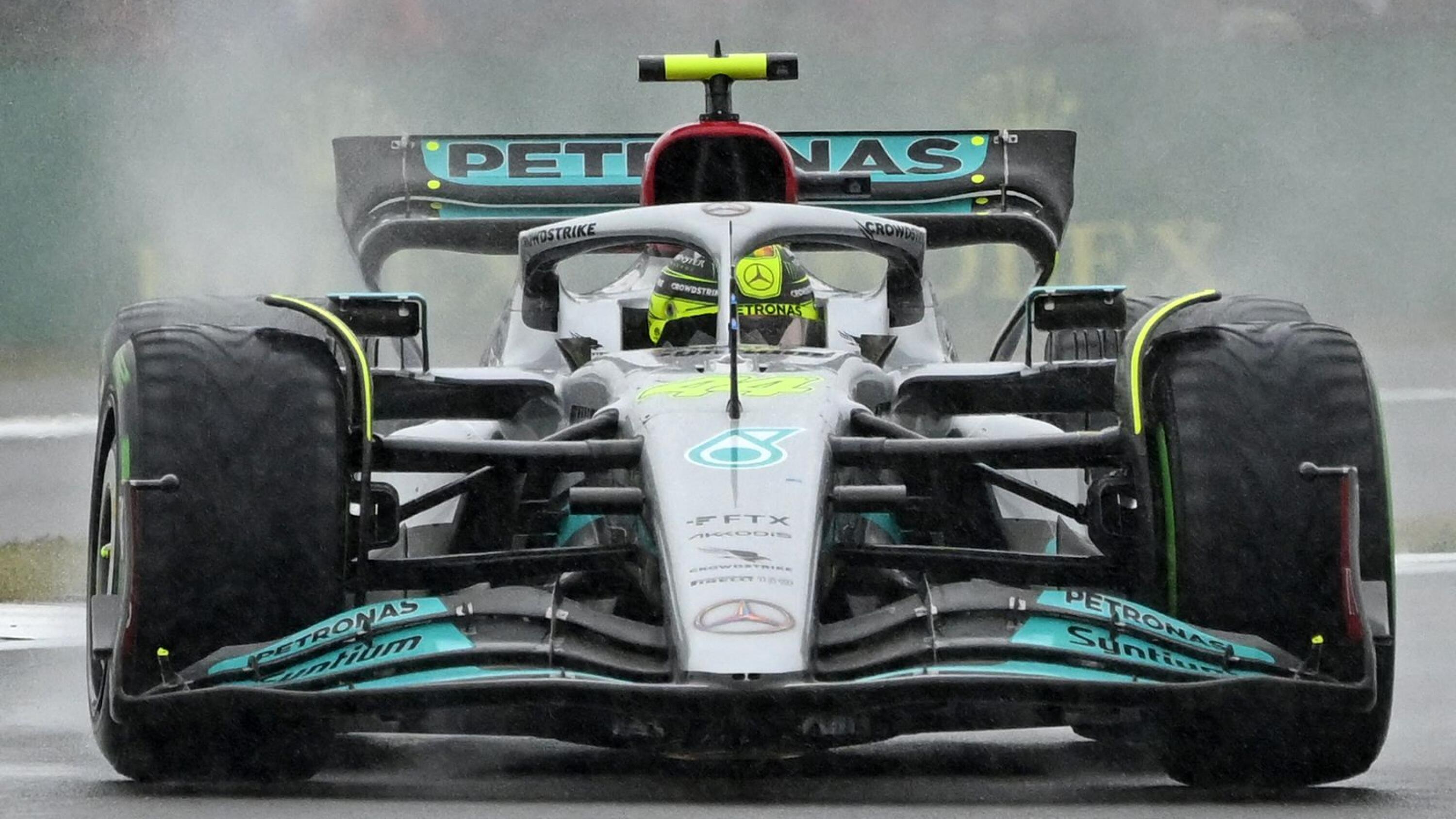Mercedes' British driver Lewis Hamilton drives in rain during the second qualifying session for the Formula One British Grand Prix at the Silverstone motor racing circuit in Silverstone, central England on Saturday