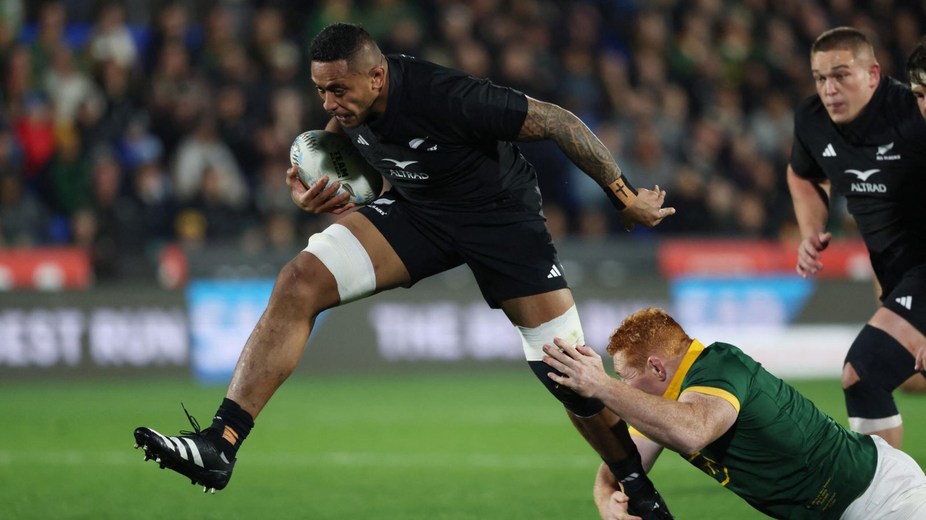 Shannon Frizell of New Zealand is tackled by South Africa’s Steven Kitshoff during the Rugby Championship Test matchat Mt Smart Stadium in Auckland