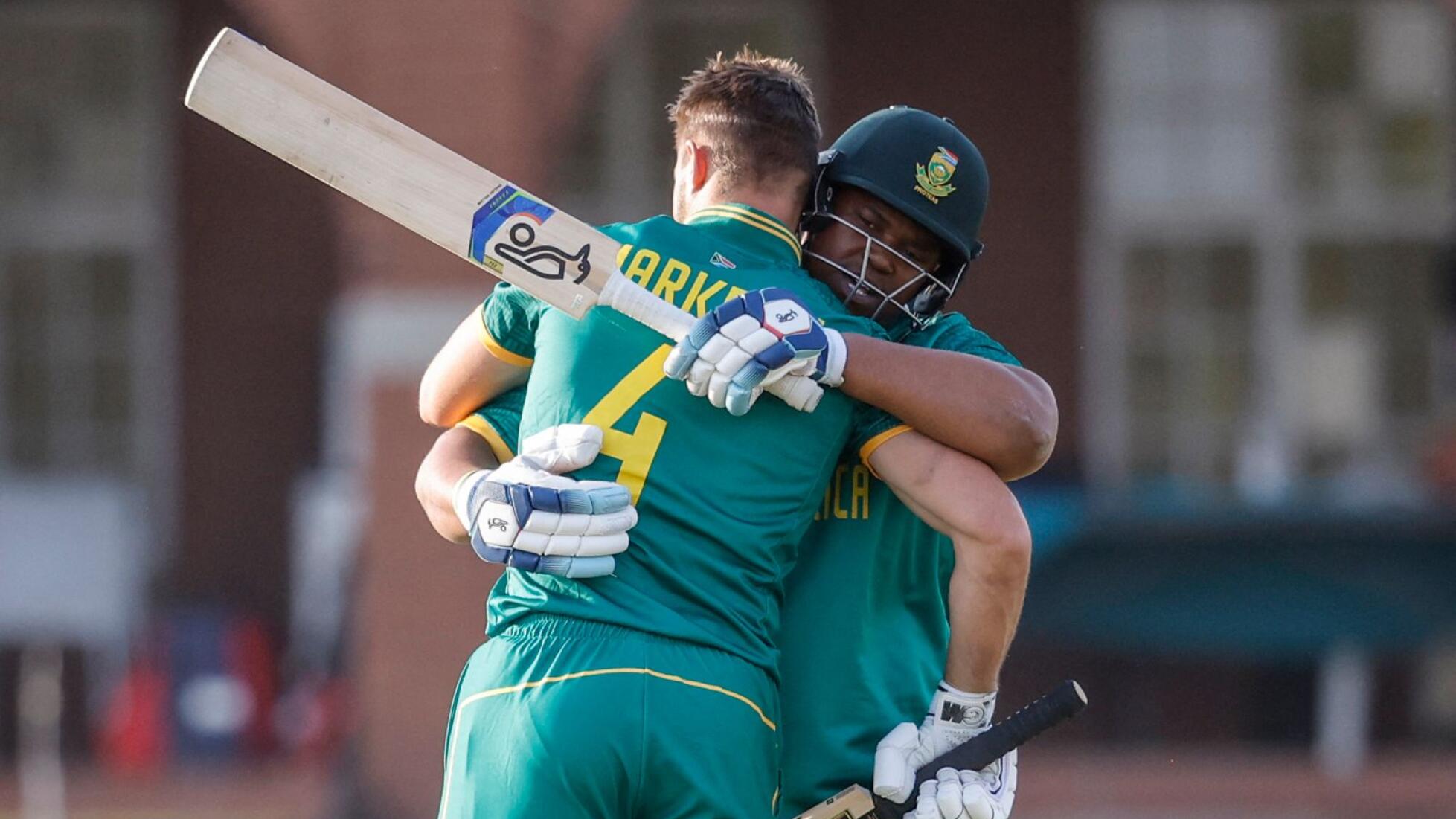 South Africa's Aiden Markram celebrates with Sisanda Magala after scoring a century during the third one-day international against Australia