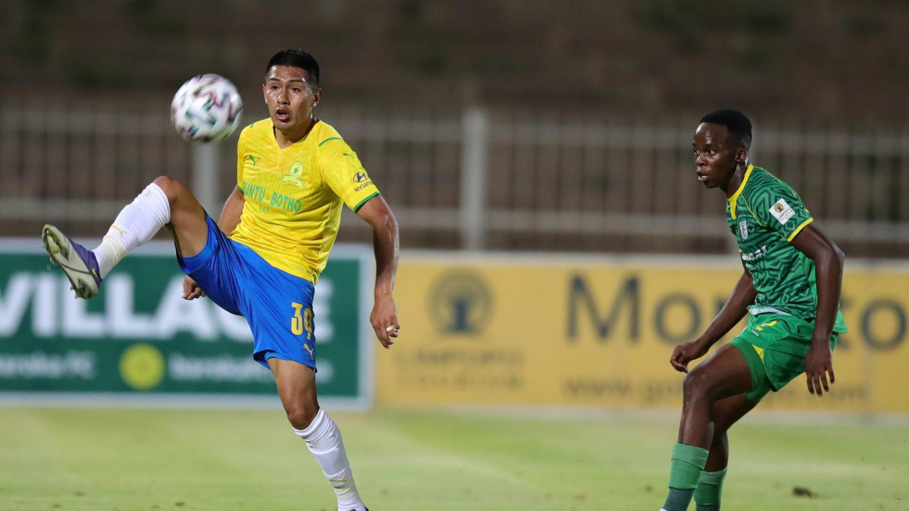 Erwin Saavedra of Mamelodi Sundowns is challenged by Basel Mphahlele of Baroka during the DStv Premiership match at Old Peter Mokaba Stadium in Polokwane, Limpopo on Monday