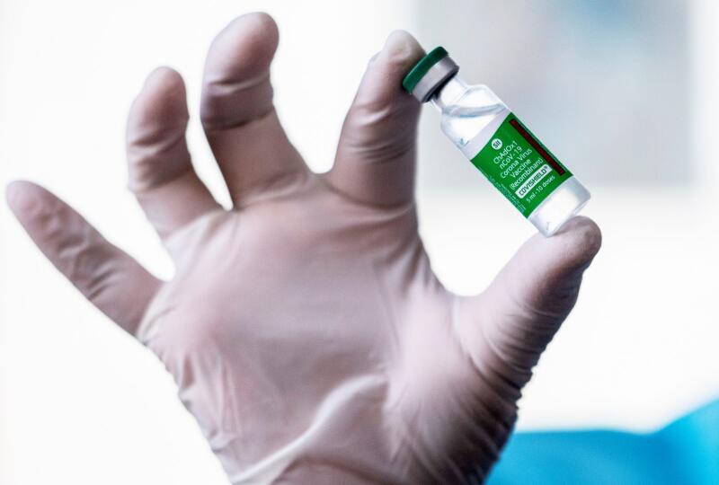 A medic shows a vial of AstraZeneca's Covishield vaccine