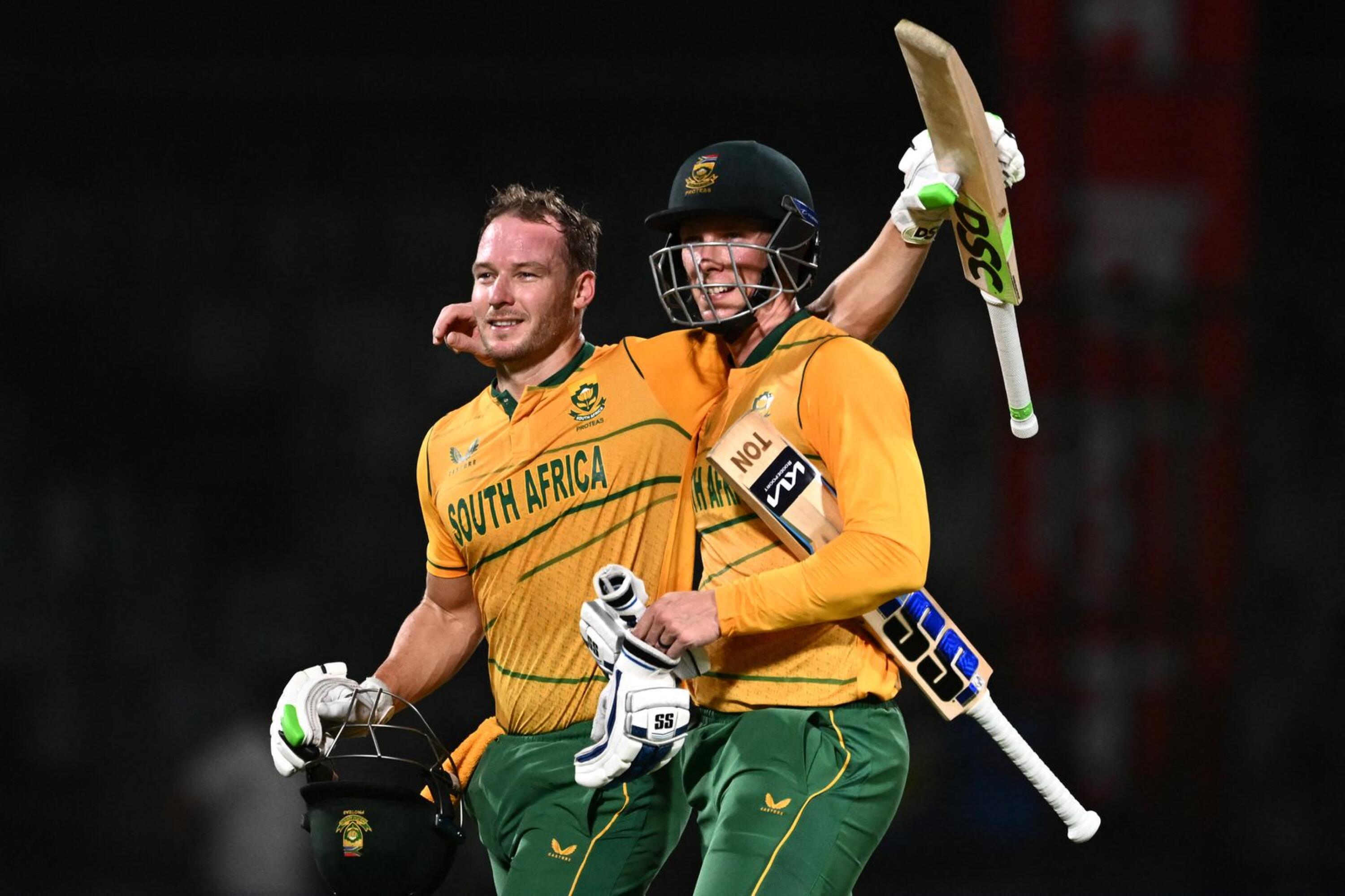 South Africa's Rassie van der Dussen (R) and David Miller celebrate after winning the first Twenty20 international cricket match against India at the Arun Jaitley Stadium in New Delhi on Thursday