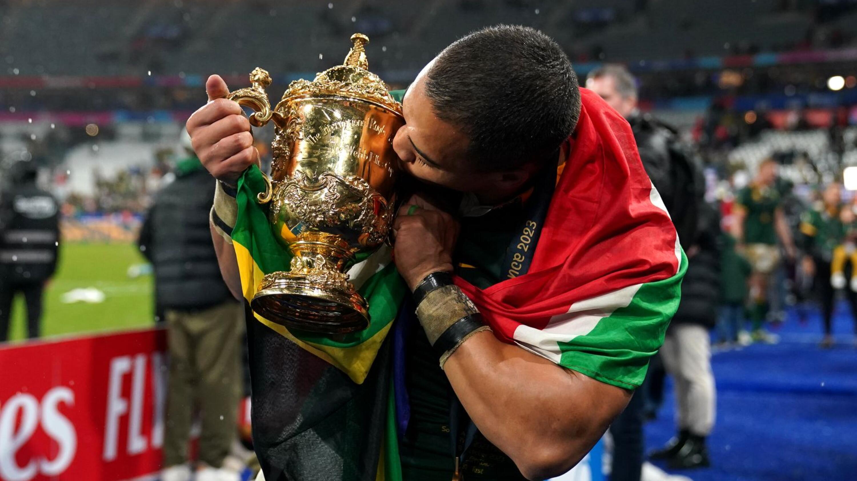 South Africa's Cheslin Kolbe celebrates with the Webb Ellis Cup following victory in the Rugby World Cup 2023 final match at the Stade de France in Paris, France