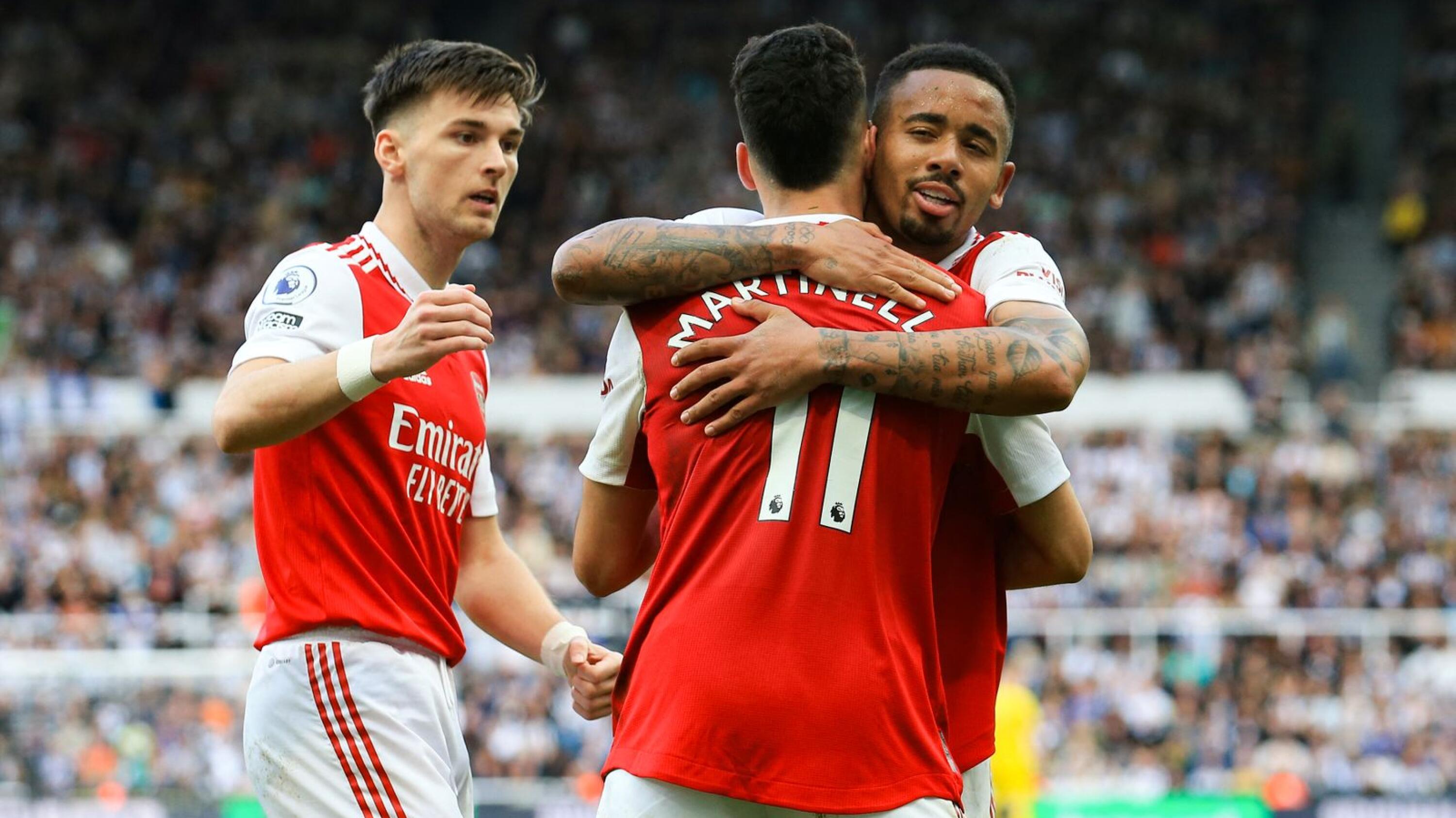Arsenal's Brazilian winger Gabriel Martinelli (centre) is congratulated by Gabriel Jesus (right) after his side go 2-0 up against Newcastle United at St James' Park in Newcastle on Sunday