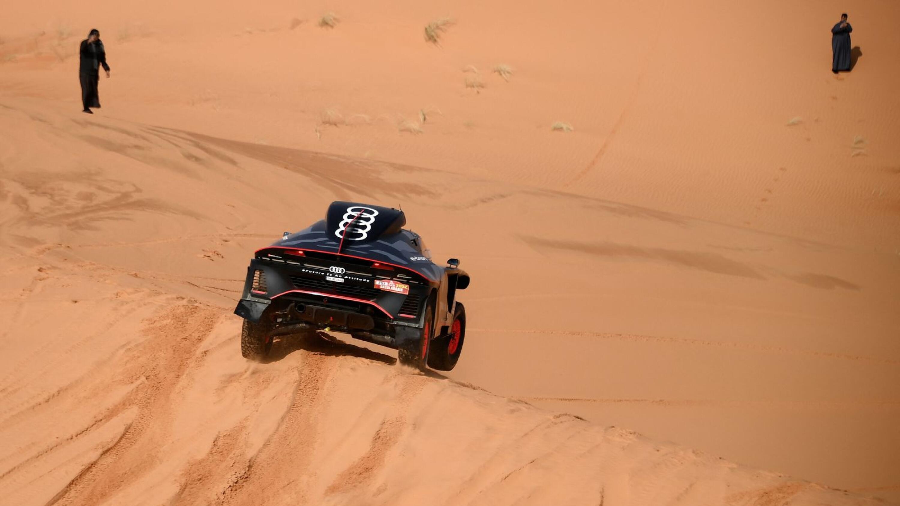 Audi's electric Spanish driver Carlos Sainz of Spain and co-driver Lucas Cruz of Spain compete during Stage 3 of the Dakar Rally 2022 between the Saudi areas of al-Artawiya and al-Qaysumah, on Tuesday