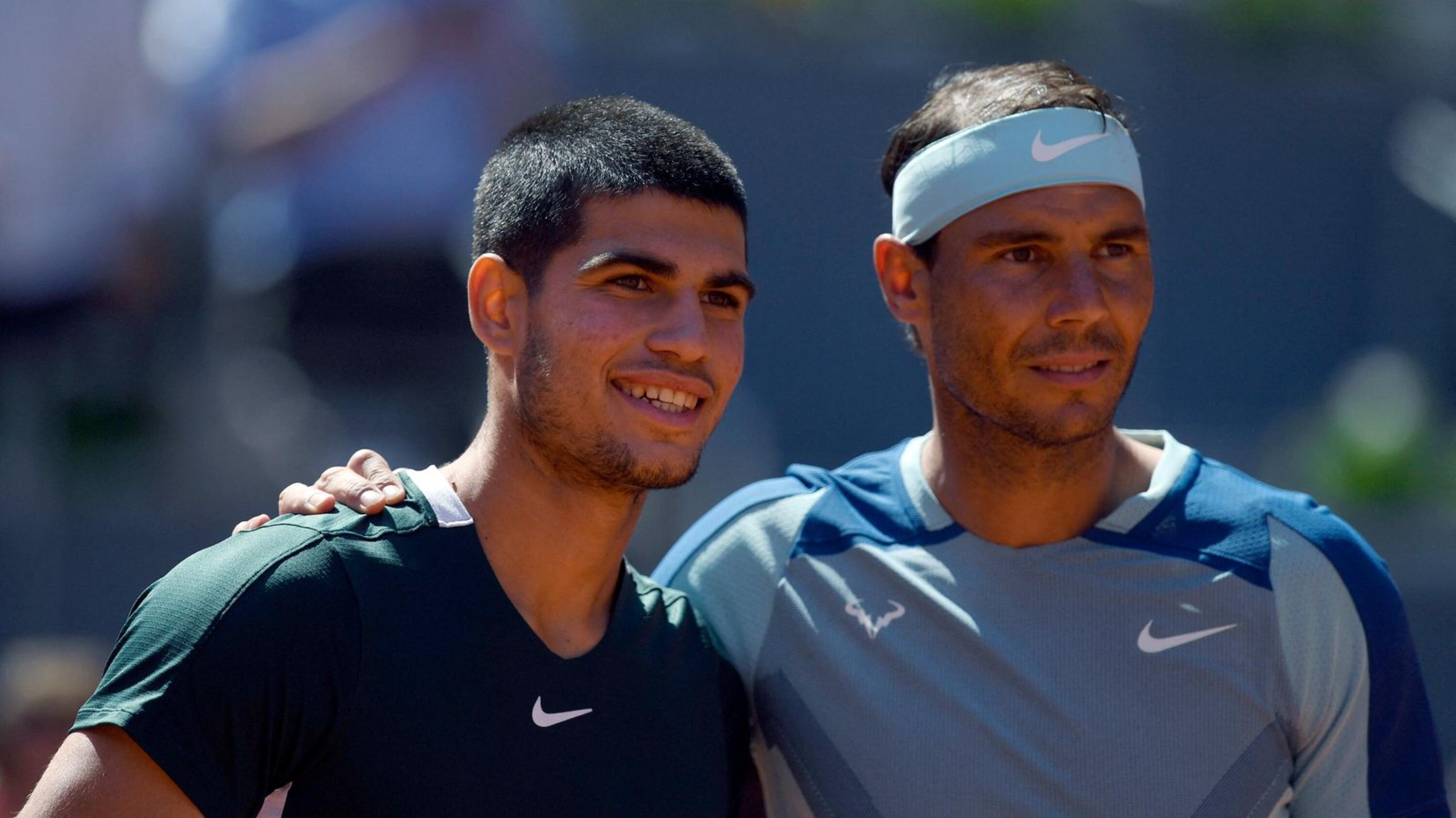 Spain's Rafael Nadal and Carlos Alcaraz pose prior to competing in their Madrid Open quarter-final