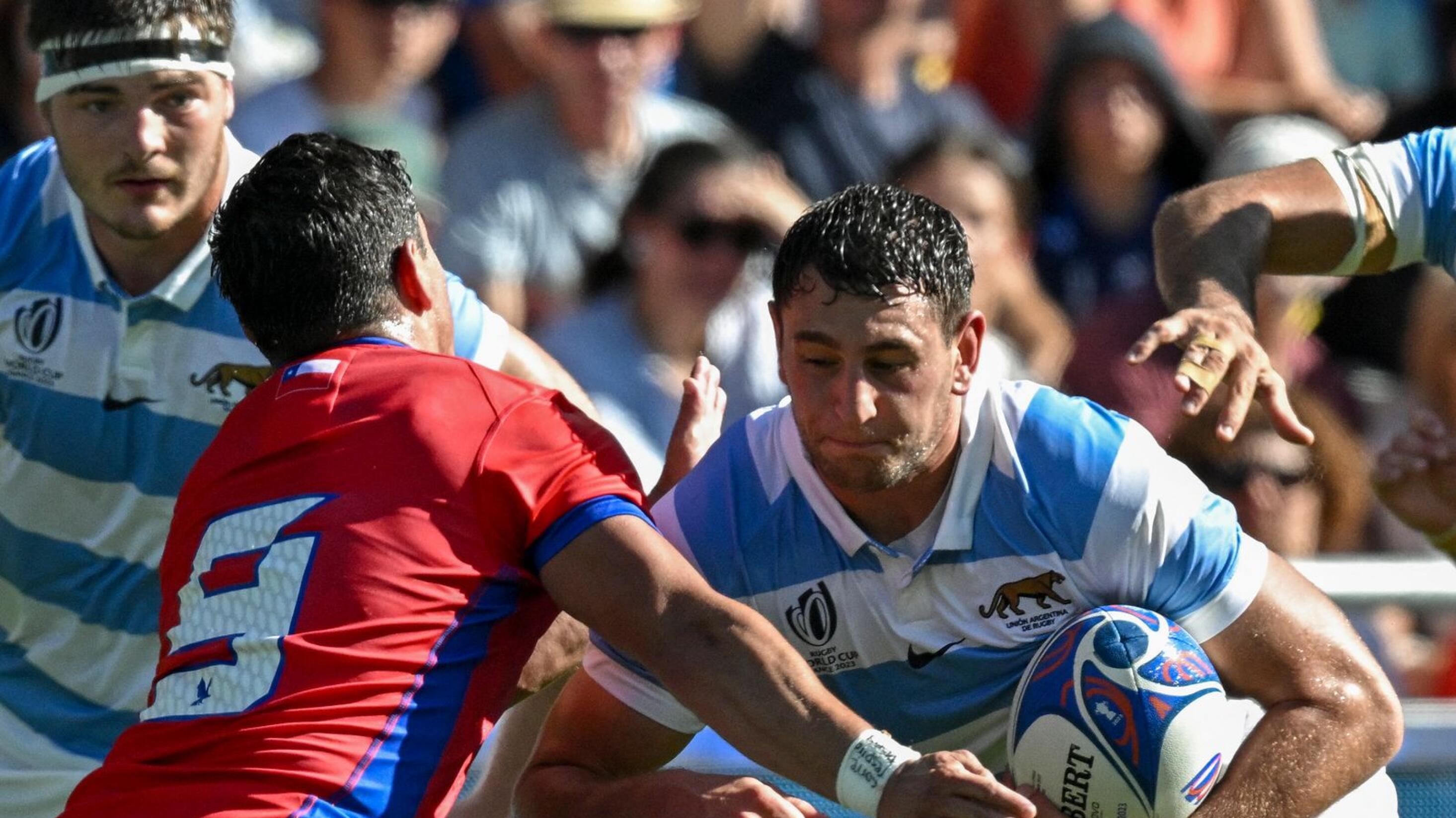 Chile's scrumhalf Marcelo Torrealba and Argentina's Tomas Cubelli fight for the ball during their Rugby World Cup Pool D match