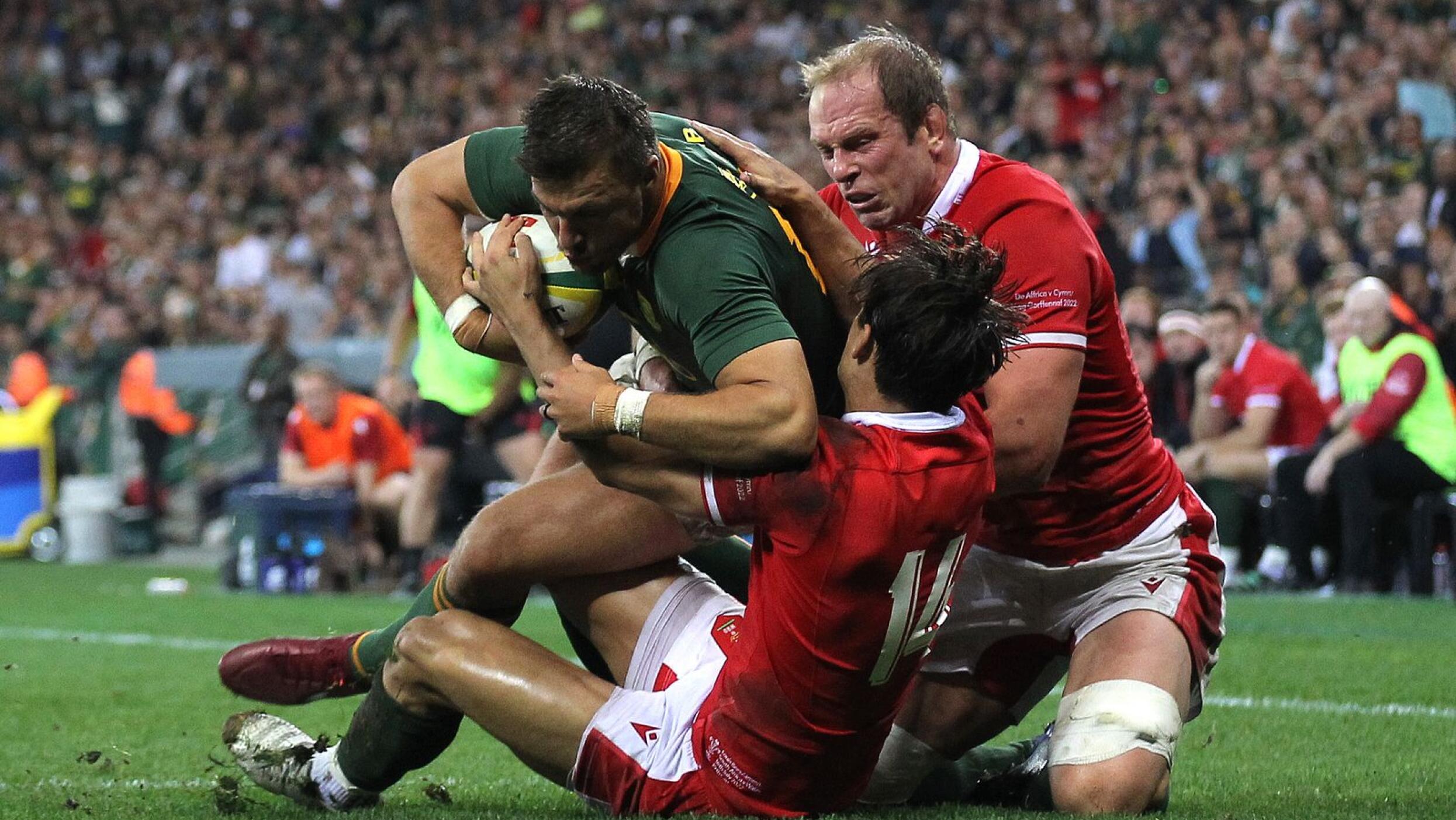 Handre Pollard is tackled short of the tryline by Alun Wyn Jones and Louis Rees-Zammit at Cape Town Stadium in July.