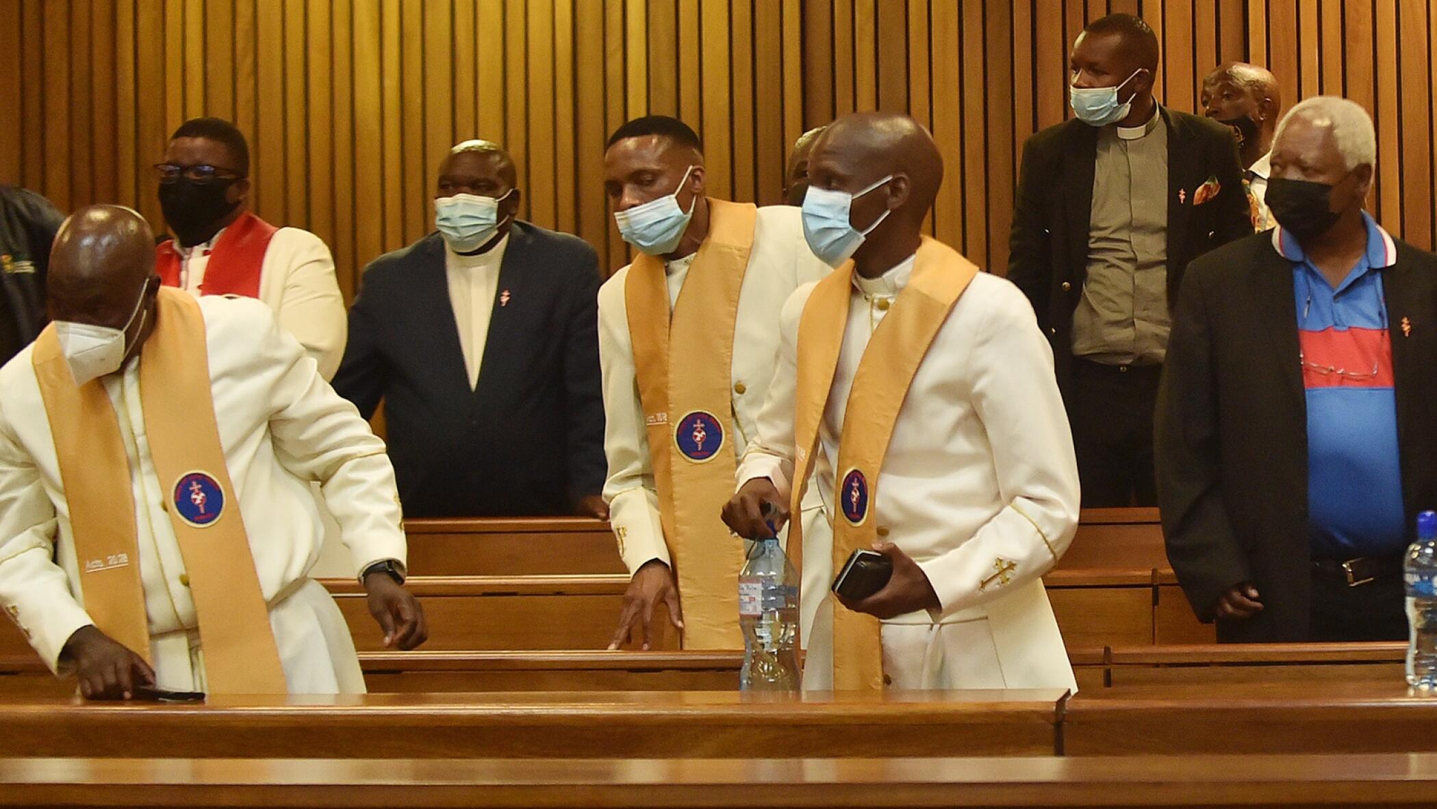 Clergymen in a courtroom.
