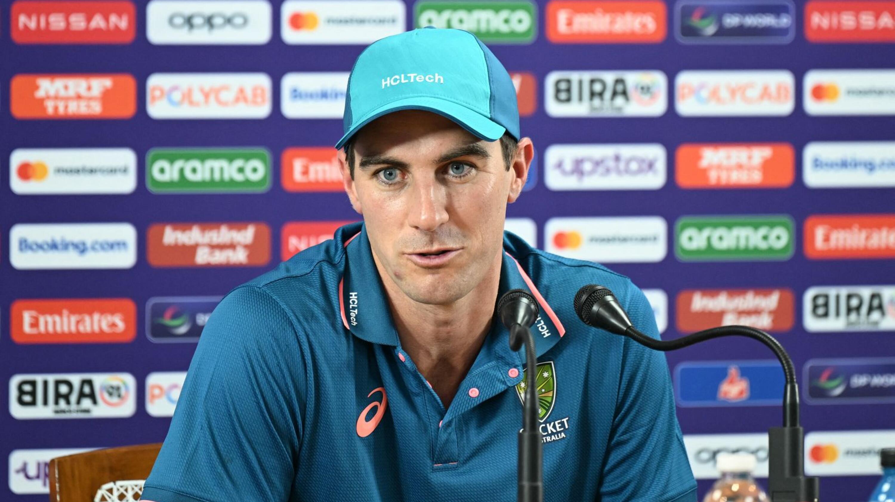 Australia's captain Pat Cummins speaks during a press conference at the M. Chinanaswamy Cricket Stadium in Bangalore