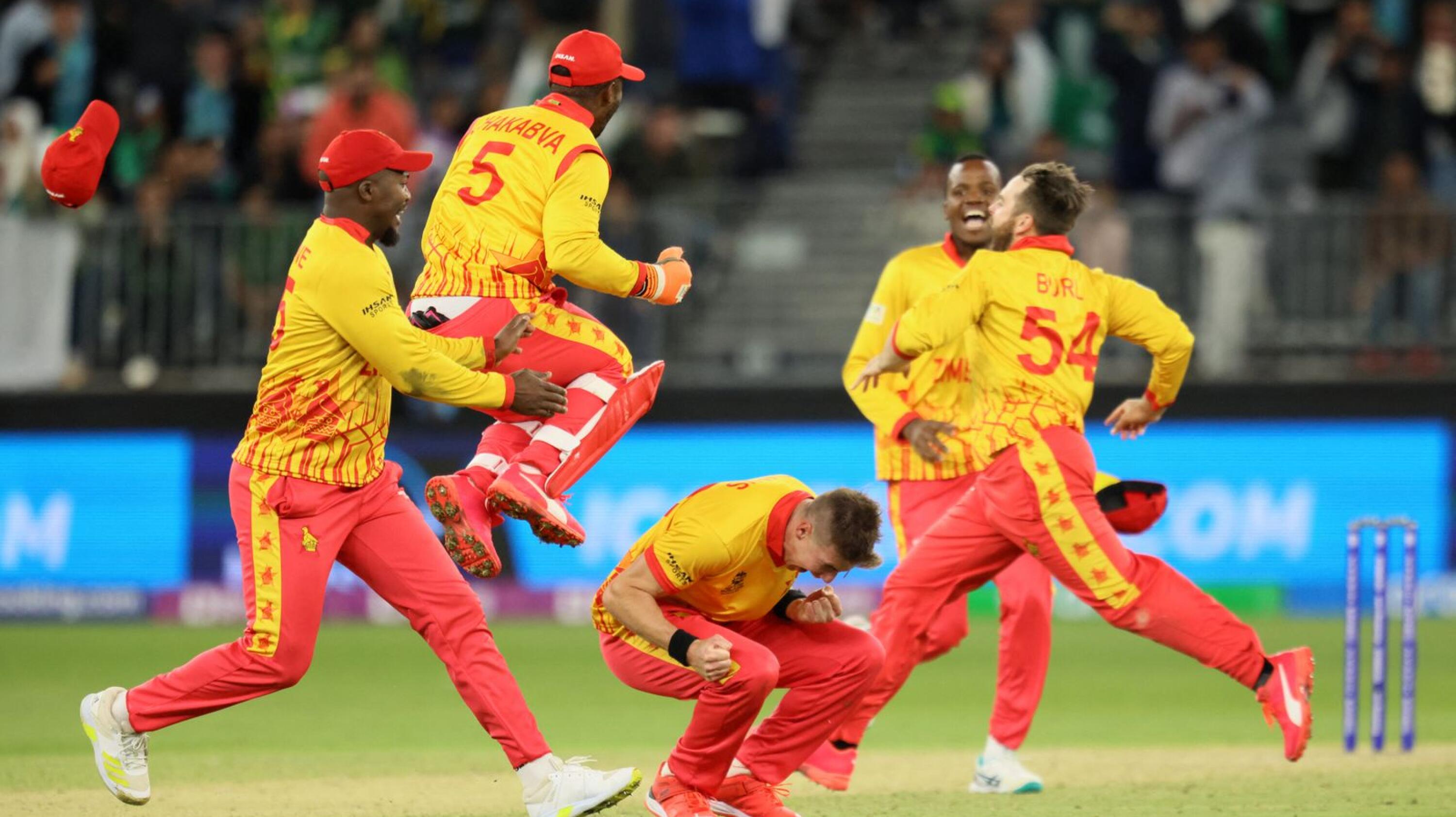 Zimbabwe's players celebrate their victory at the end of their ICC men’s T20 World Cup match against Pakistan in Perth on Thursday
