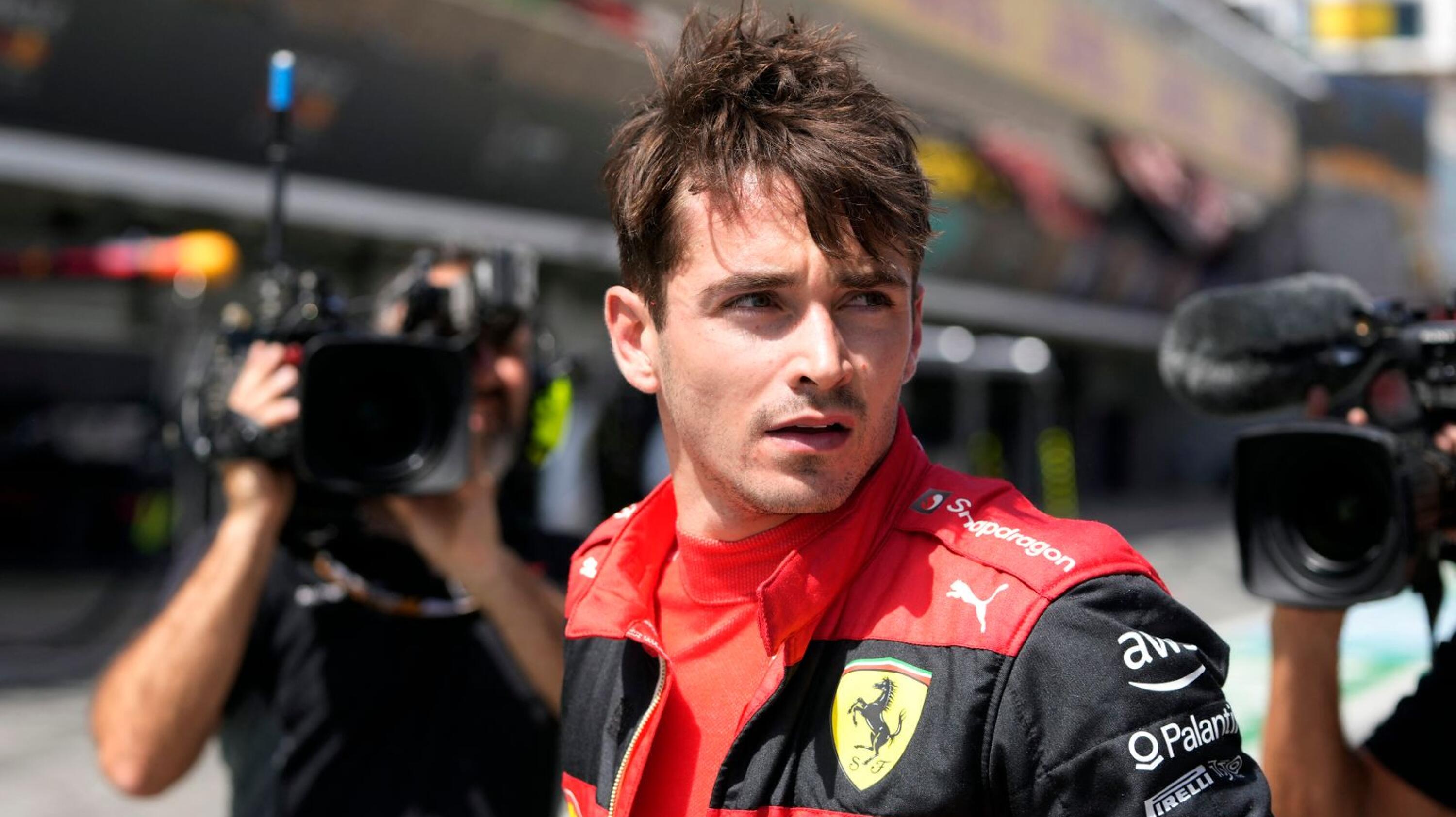 Ferrari's Monegasque driver Charles Leclerc reacts at the pitlane after his car's breakdown during the Spanish Formula One Grand Prix at the Circuit de Catalunya in Montmelo, on the outskirts of Barcelona on Sunday