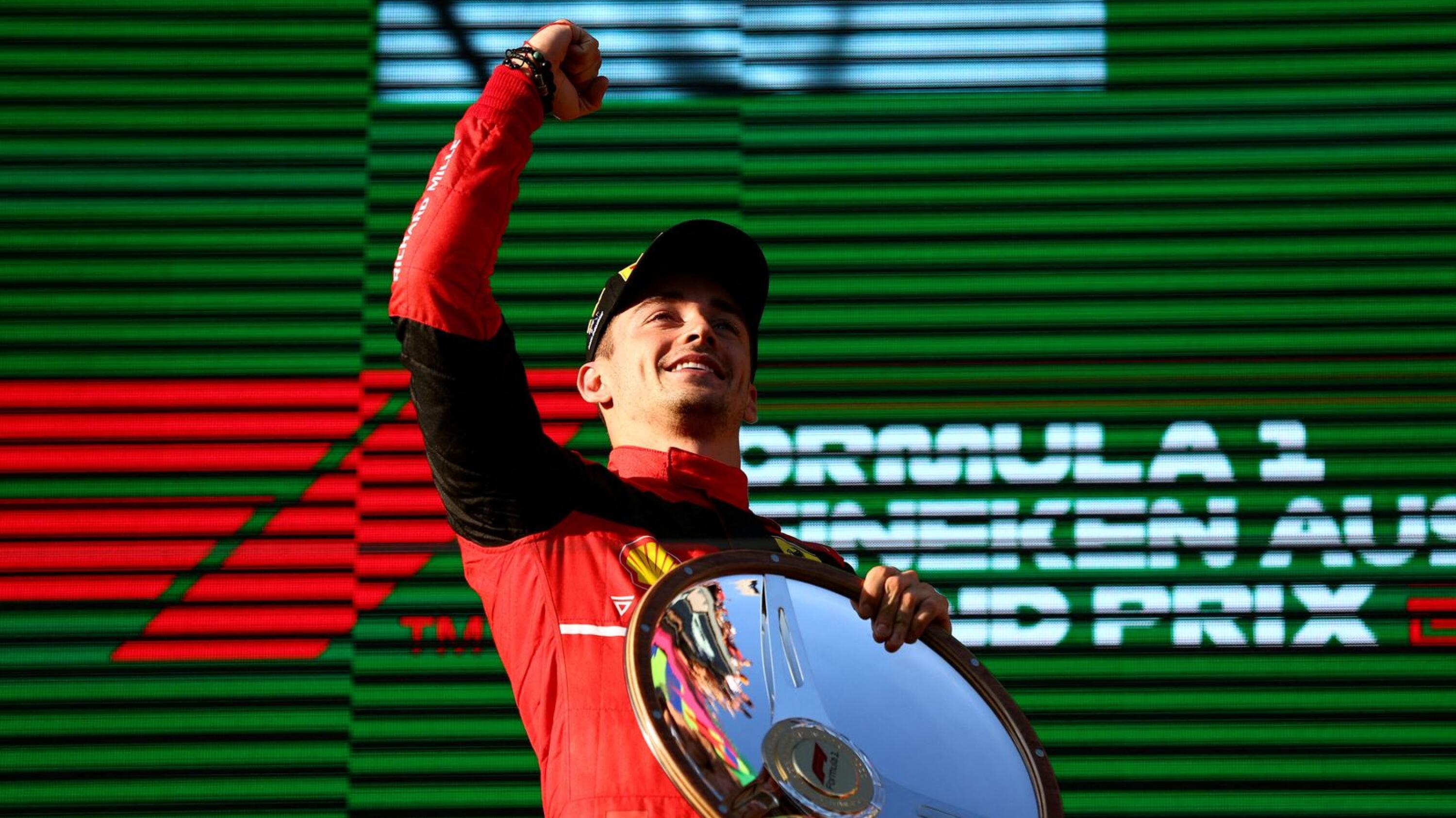 Ferrari's Charles Leclerc celebrates on the podium after winning the Australin Grand Prix on Sunday