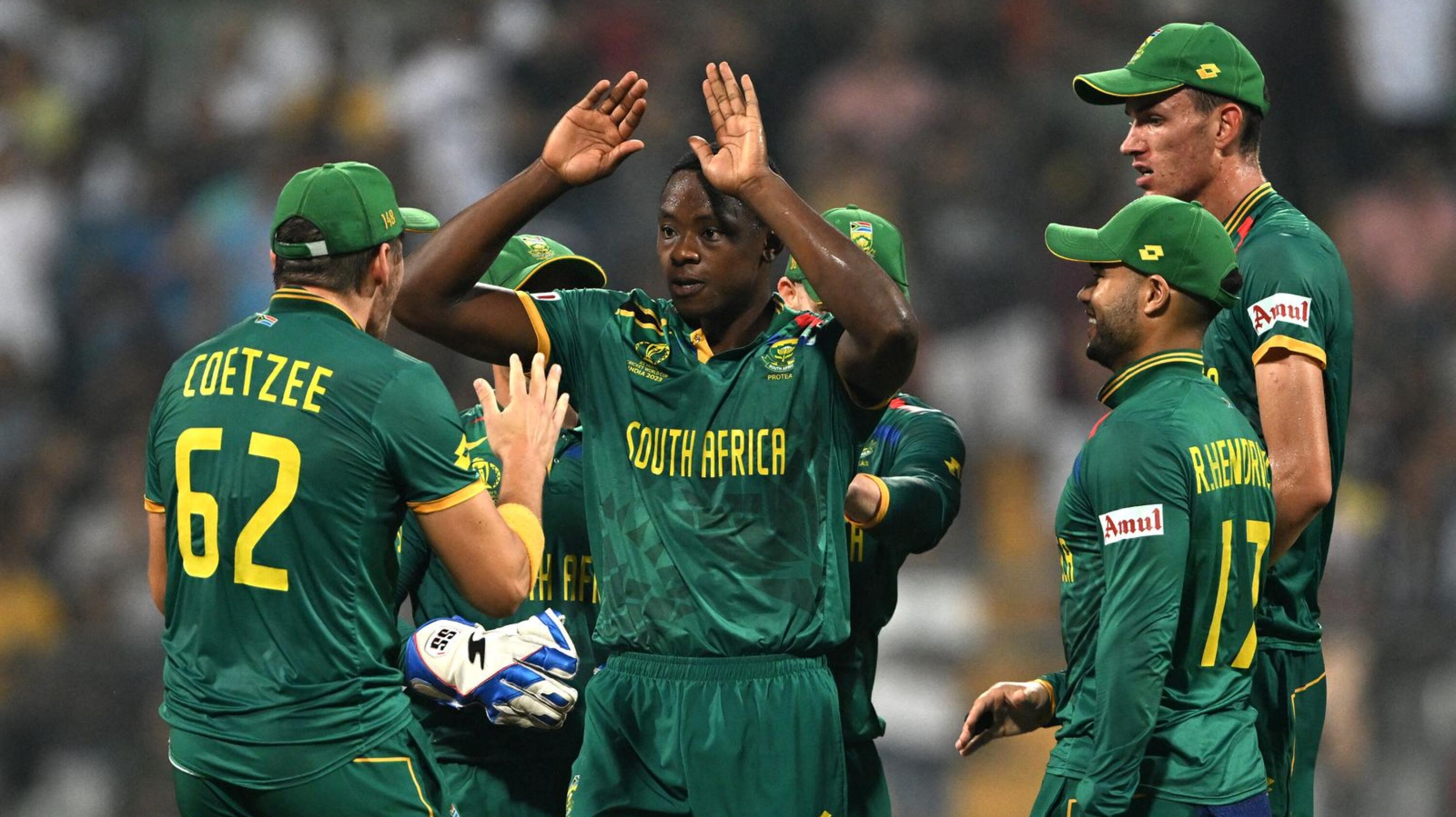 South Africa's Kagiso Rabada celebrates with teammates after taking the wicket of England's Ben Stokes during their Cricket World Cup match