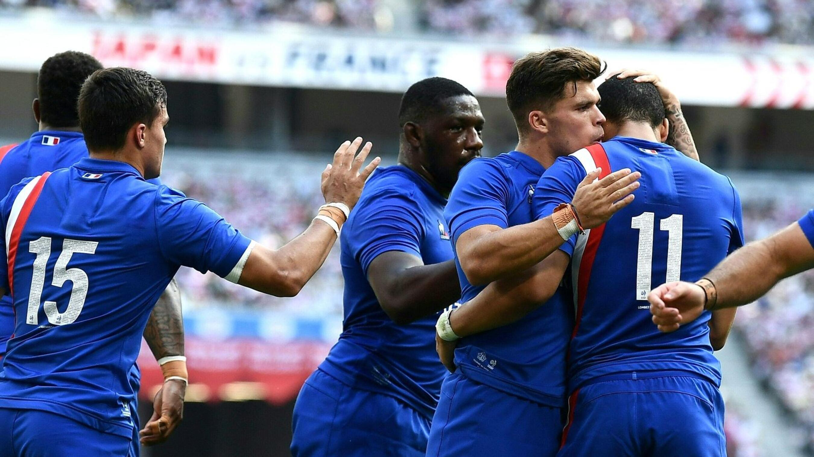 France's Matthis Lebel celebrates with teammates after scoring a try during their second Test match against Japan at the National Stadium in Tokyo on Saturday